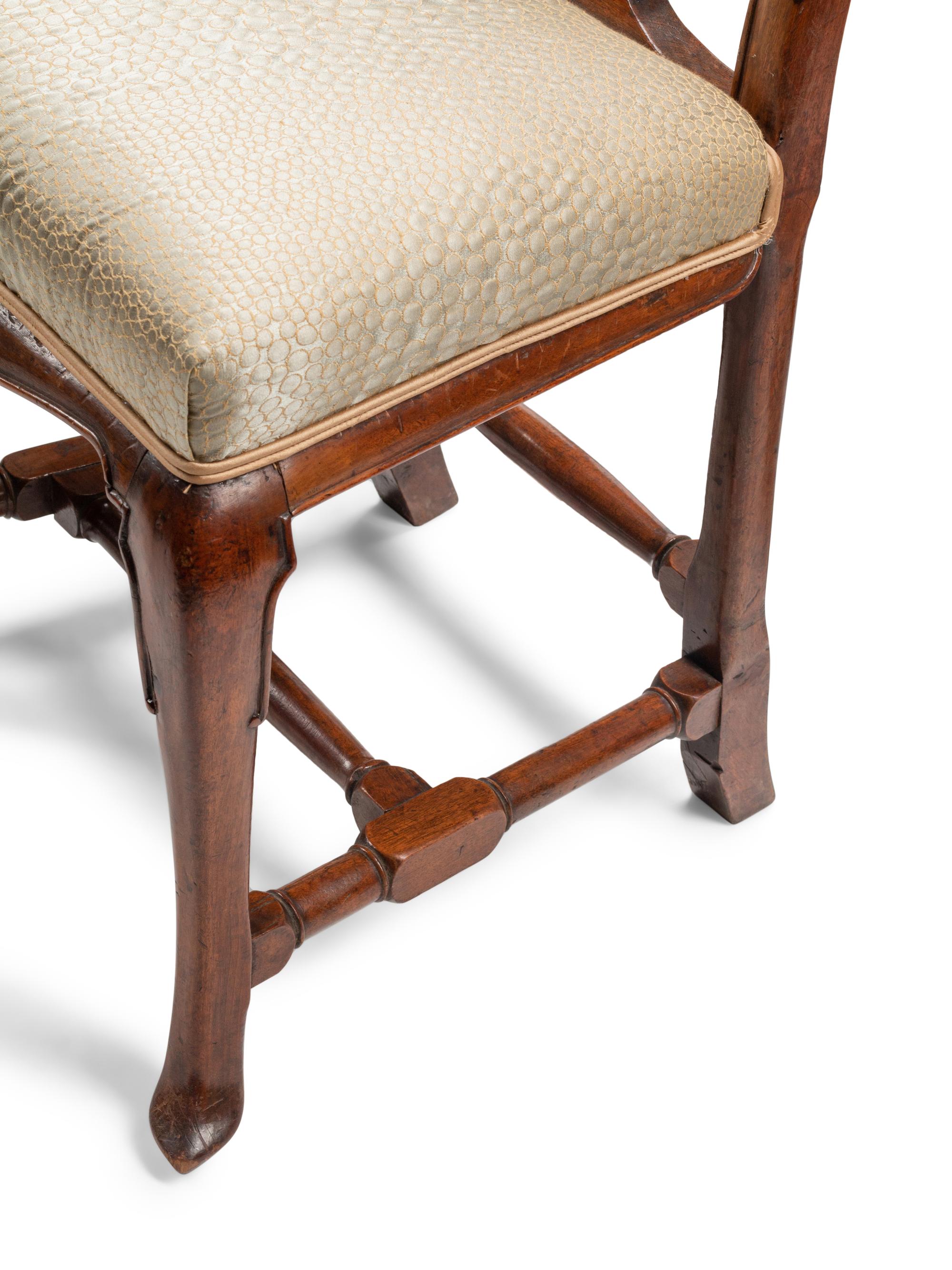 A Set of Eight Dutch Rococo Walnut Dining Chairs