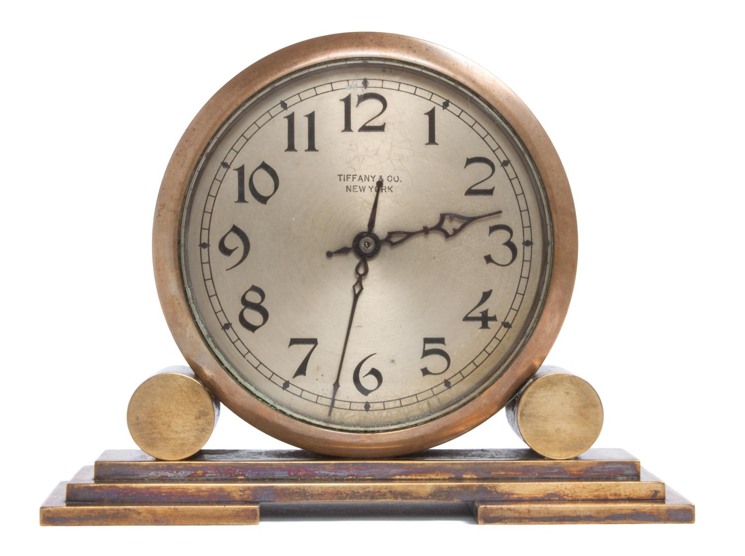 An Art Deco Brass Desk Clock Height 4 7/8 x width 6 3/8 x depth 2 1/4 inches. — TIFFANY & CO., NEW YORK