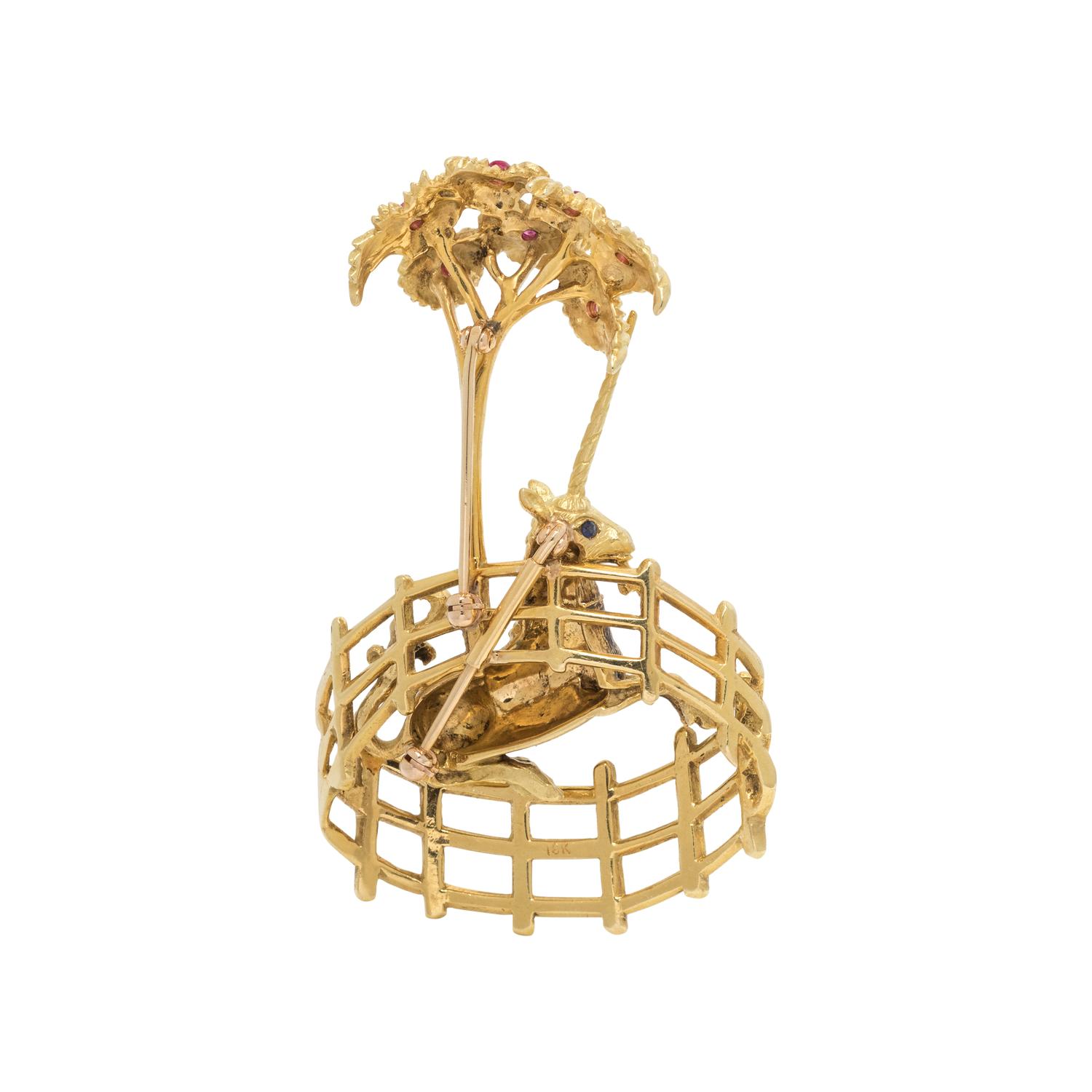 YELLOW GOLD AND GEMSTONE UNICORN IN CAPTIVITY BROOCH