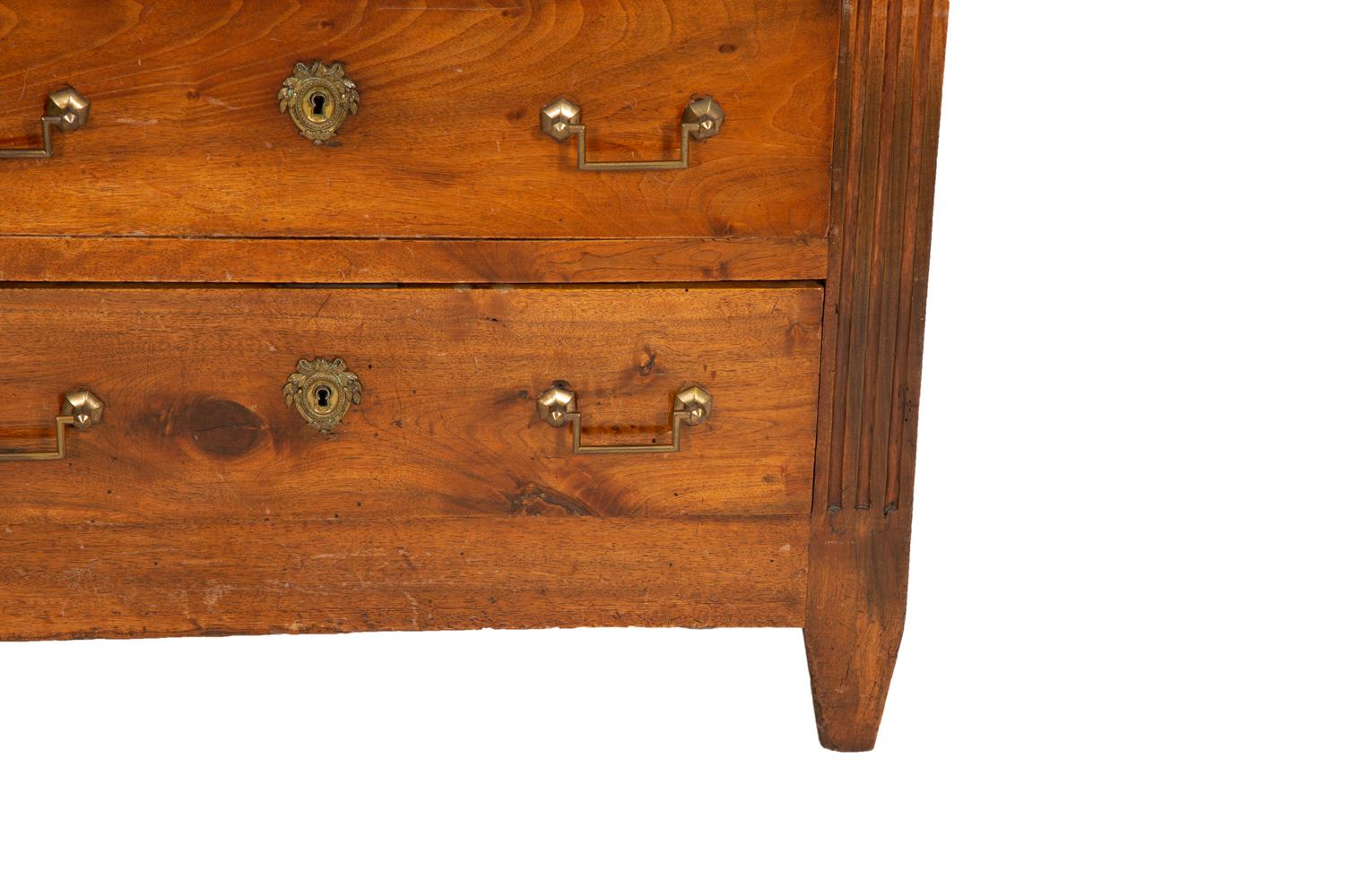 A German Walnut Four-Drawer Commode with Marble Top