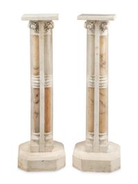 A Pair of Continental Carved Marble and Onyx Quadripartite Pedestals