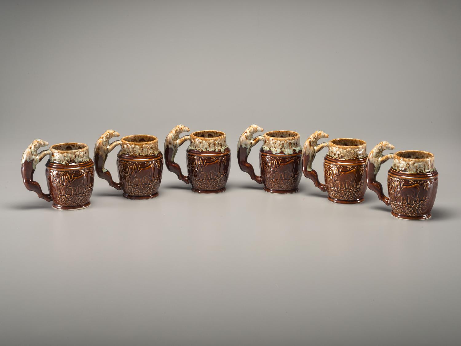 Fifteen Rockingham Glaze Mugs and Pig Banks