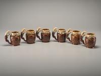 Fifteen Rockingham Glaze Mugs and Pig Banks