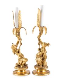 A Pair of Figural Gilt Metal Candlesticks