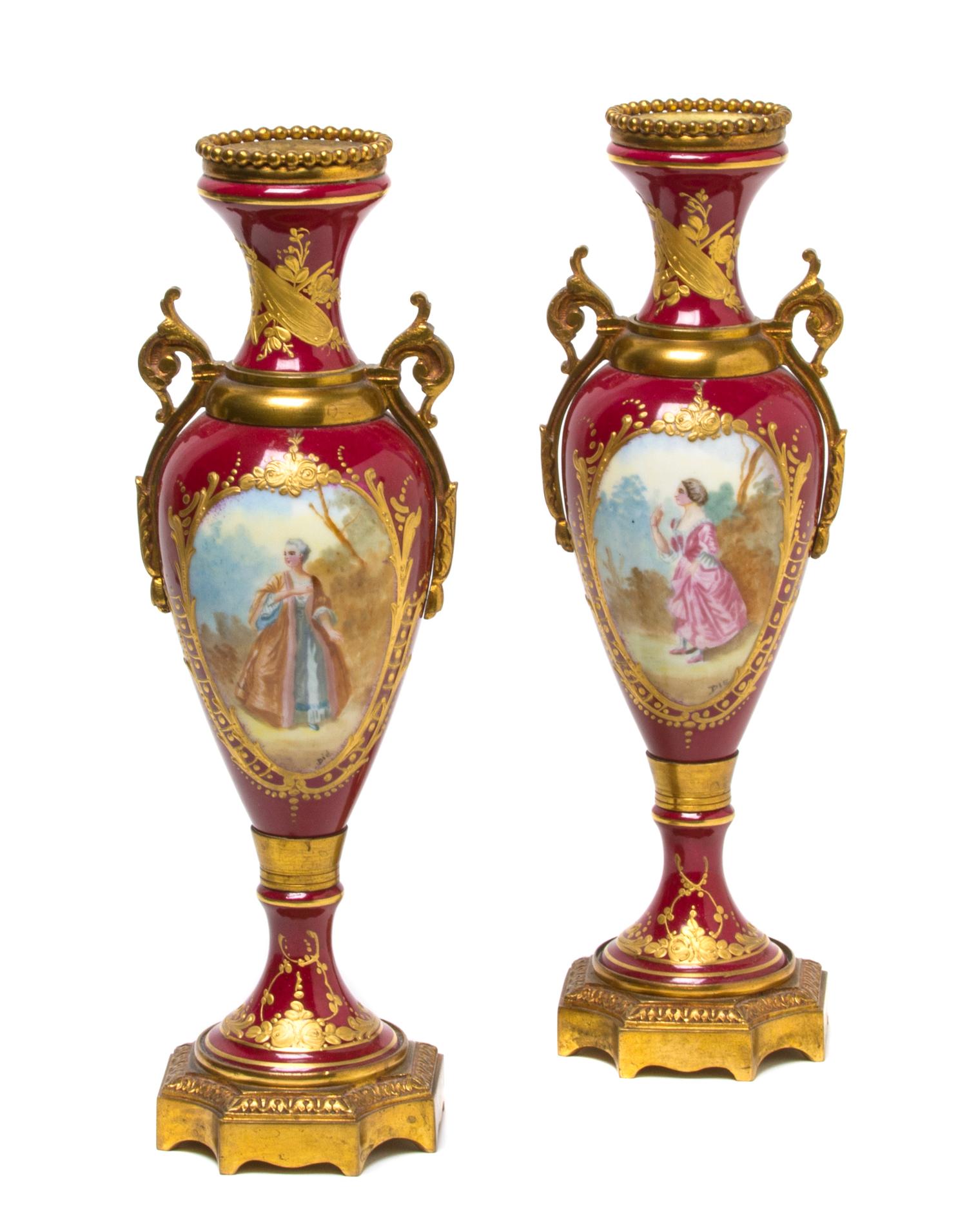 A Pair of Sevres Style Porcelain and Gilt Metal Mounted Urns, Height 10 1/2 inches.