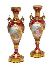 A Pair of Sevres Style Porcelain and Gilt Metal Mounted Urns, Height 10 1/2 inches.