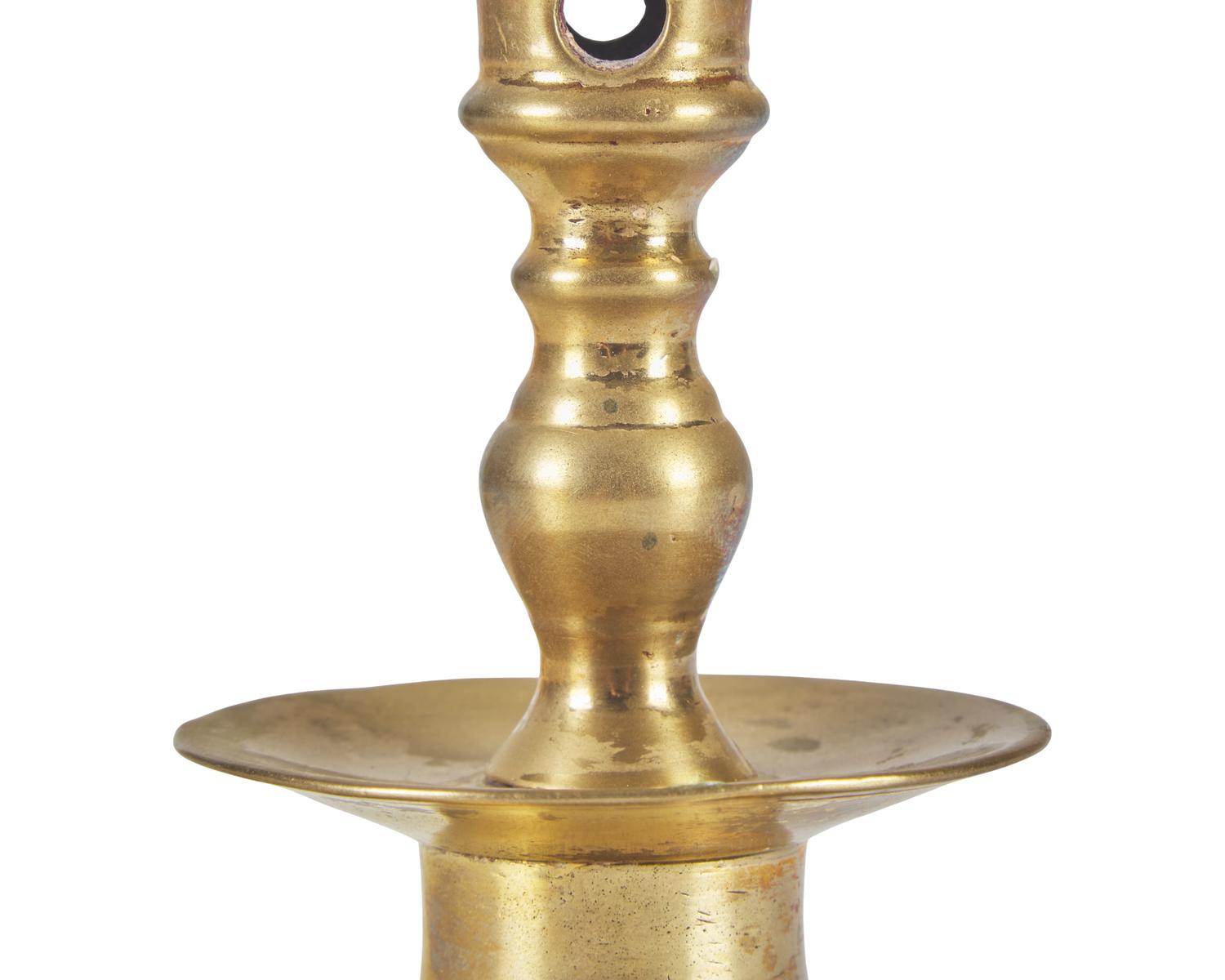 A Group of Three Dutch Brass Candlesticks
