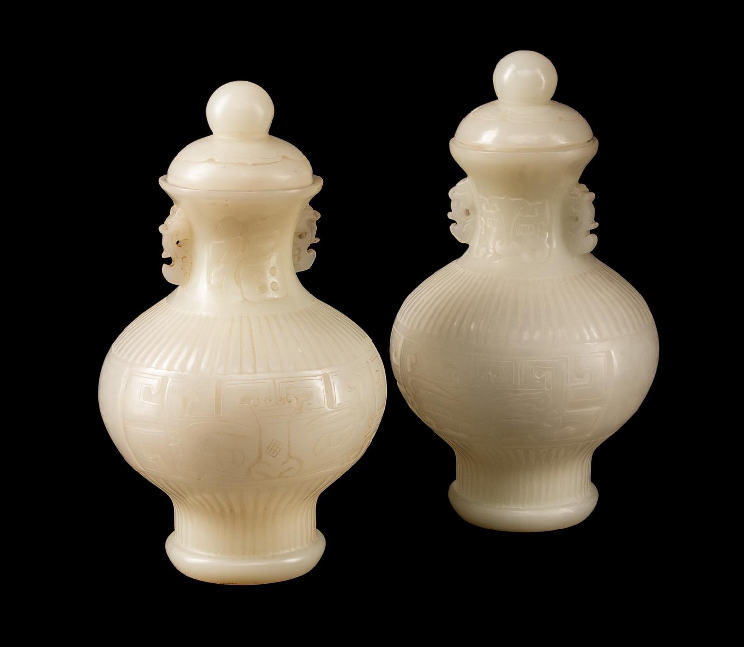 A Pair of Chinese Peking Style Glass Vases and Covers