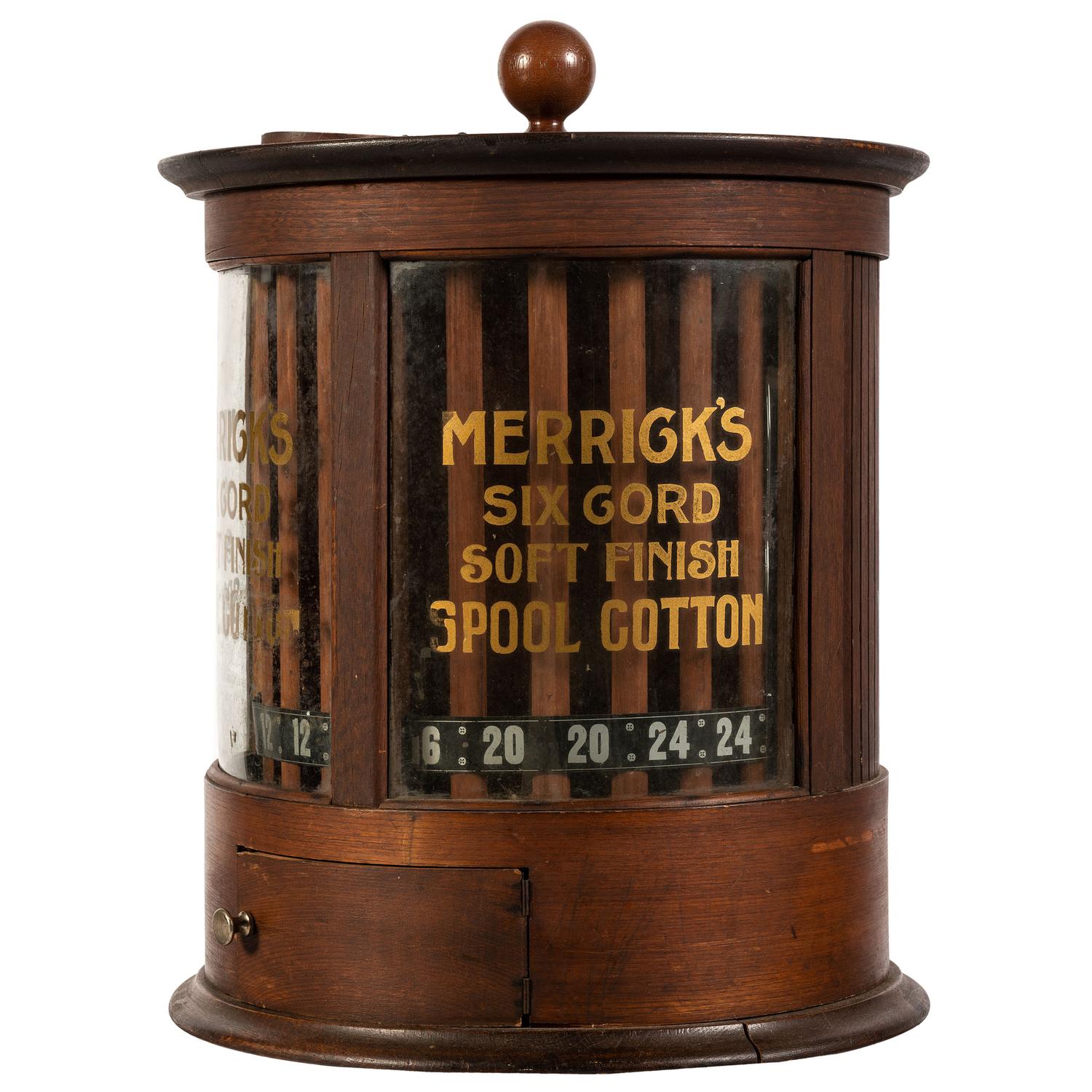 A Merrick's Six Cord Cylindrical Spool Cabinet