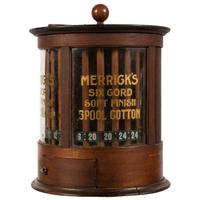 A Merrick's Six Cord Cylindrical Spool Cabinet
