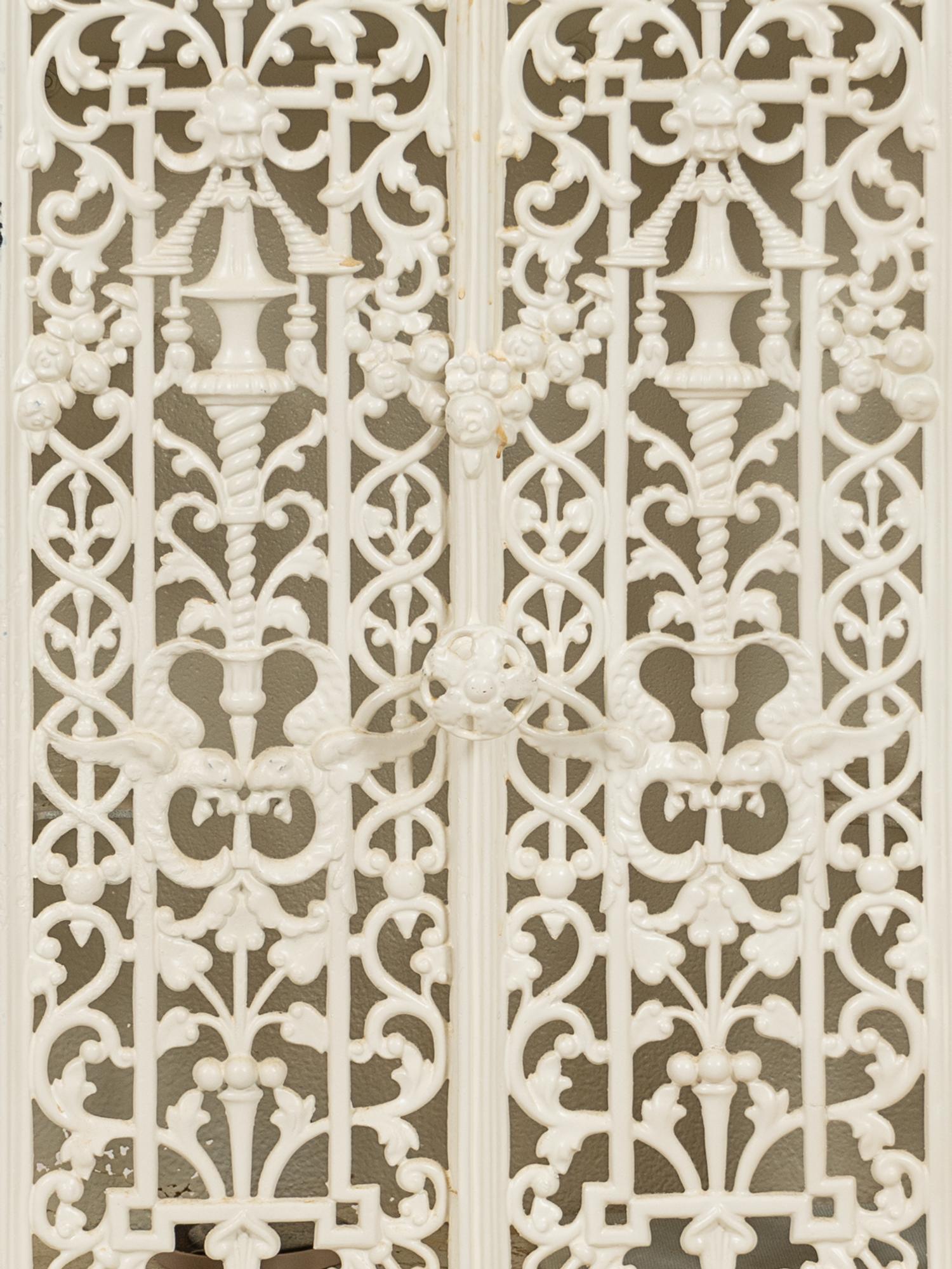 A White-Painted Cast Iron Cabinet