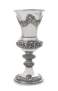 An Austrian Silver Chalice, J. Reiner, Vienna, 1847, the tapering cup worked to show repousee floral swags, raised on a similarly decor