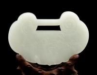 A White Jade Lock-Form Pendant with Stand