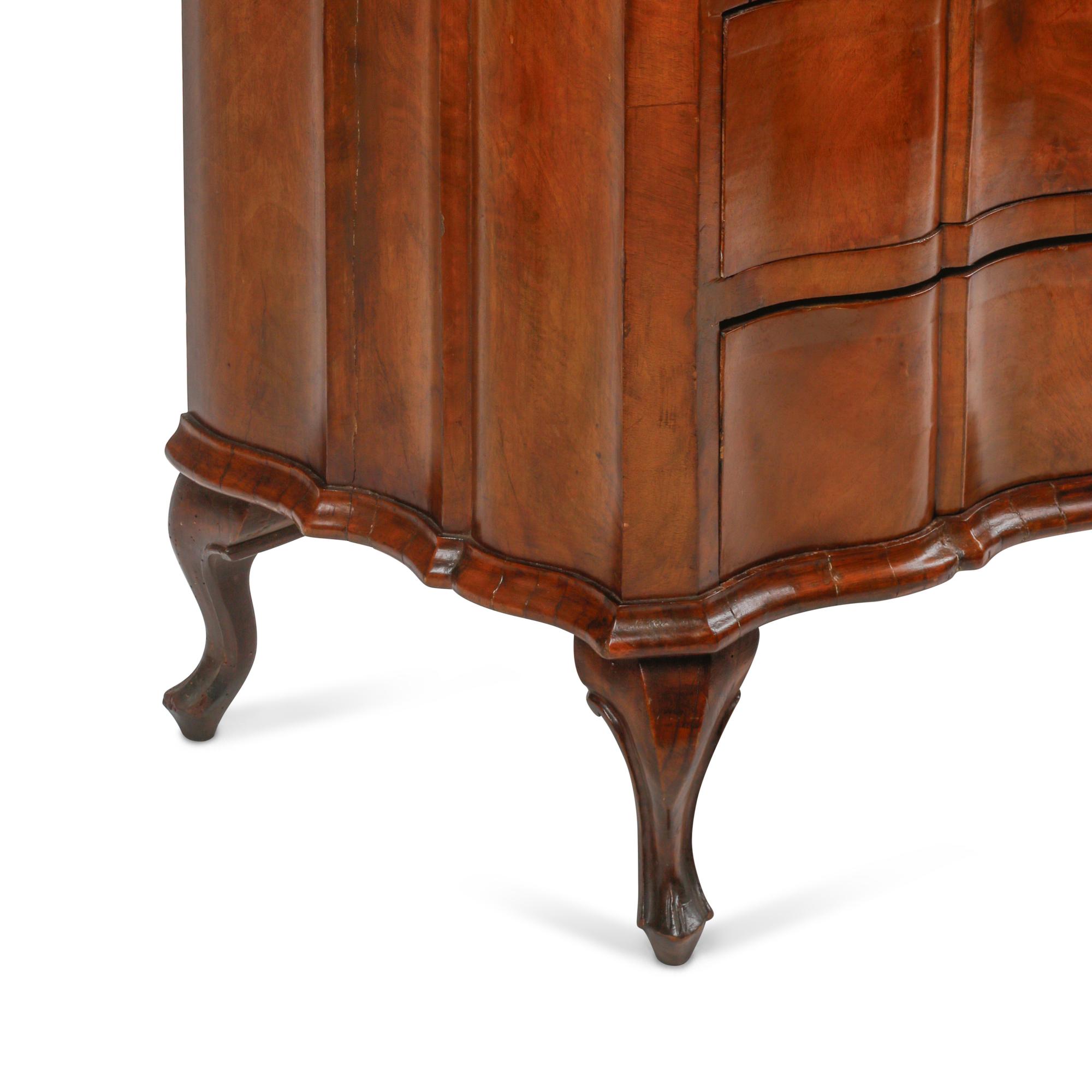 An Italian Walnut Serpentine-Front Chest of Drawers