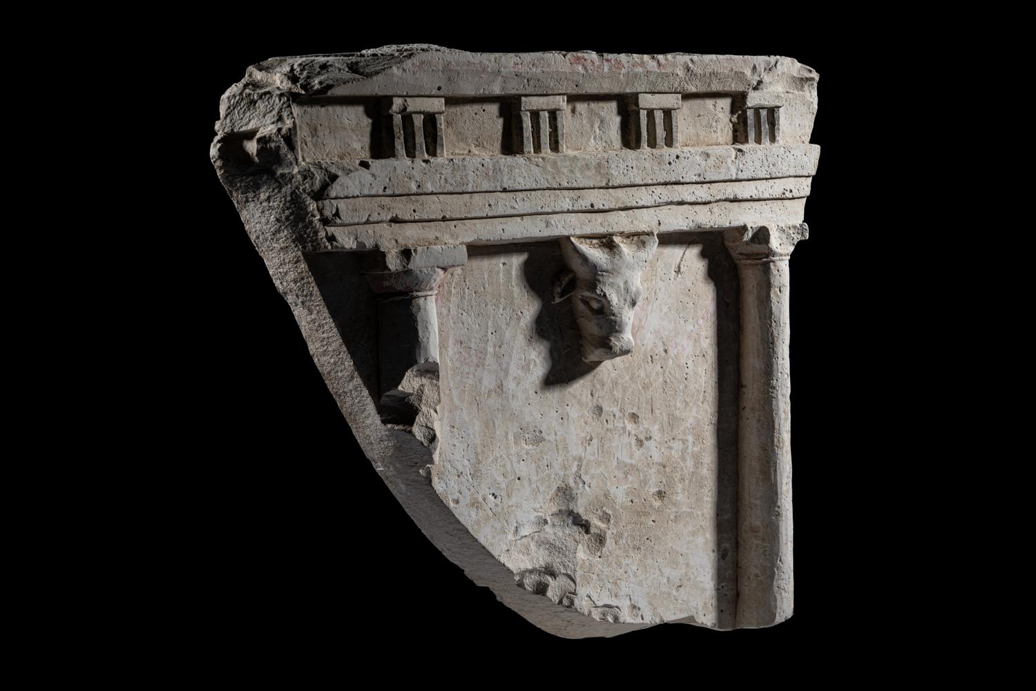 A Greco-Roman Limestone Fragment with Entablature and Bucranium