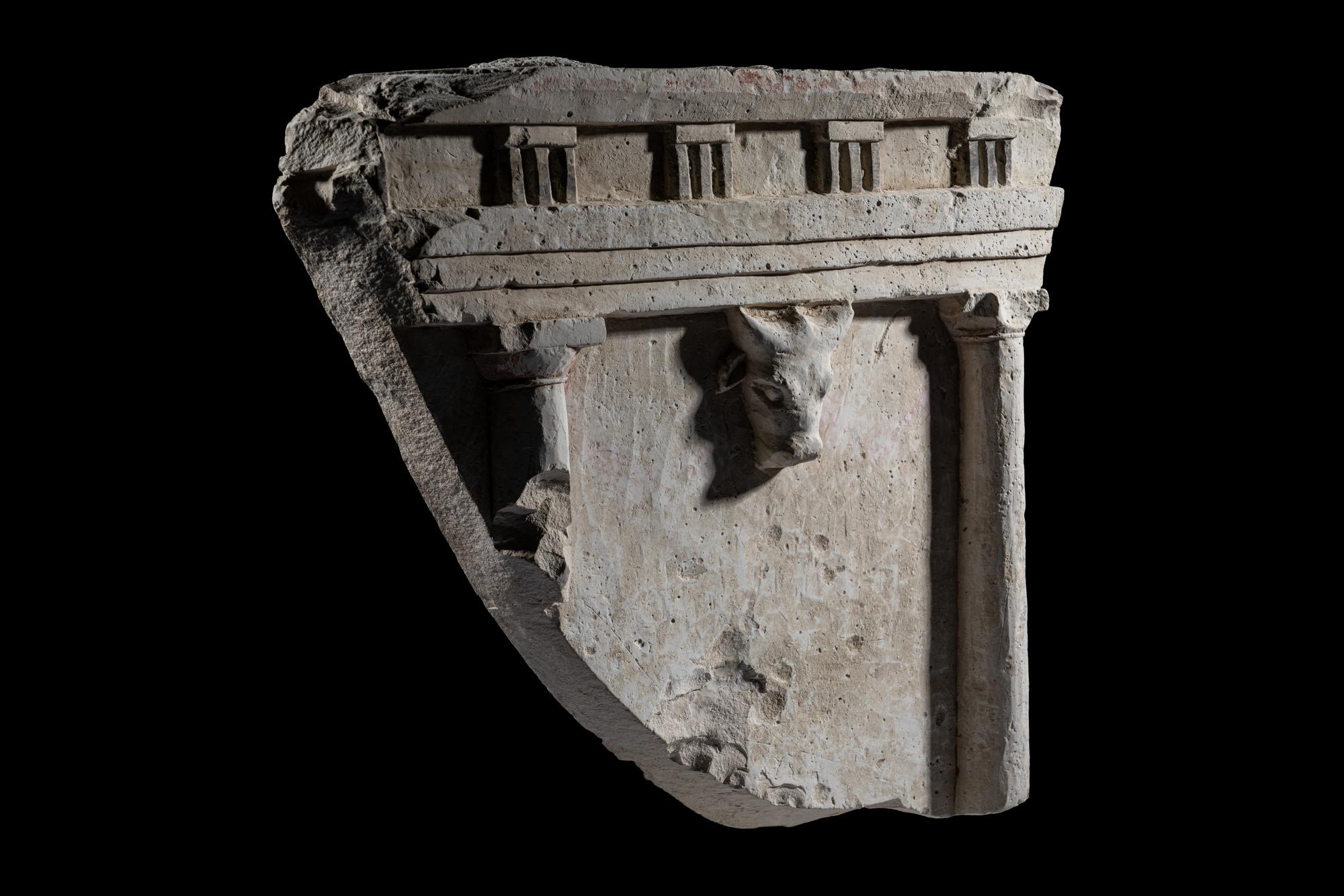 A Greco-Roman Limestone Fragment with Entablature and Bucranium