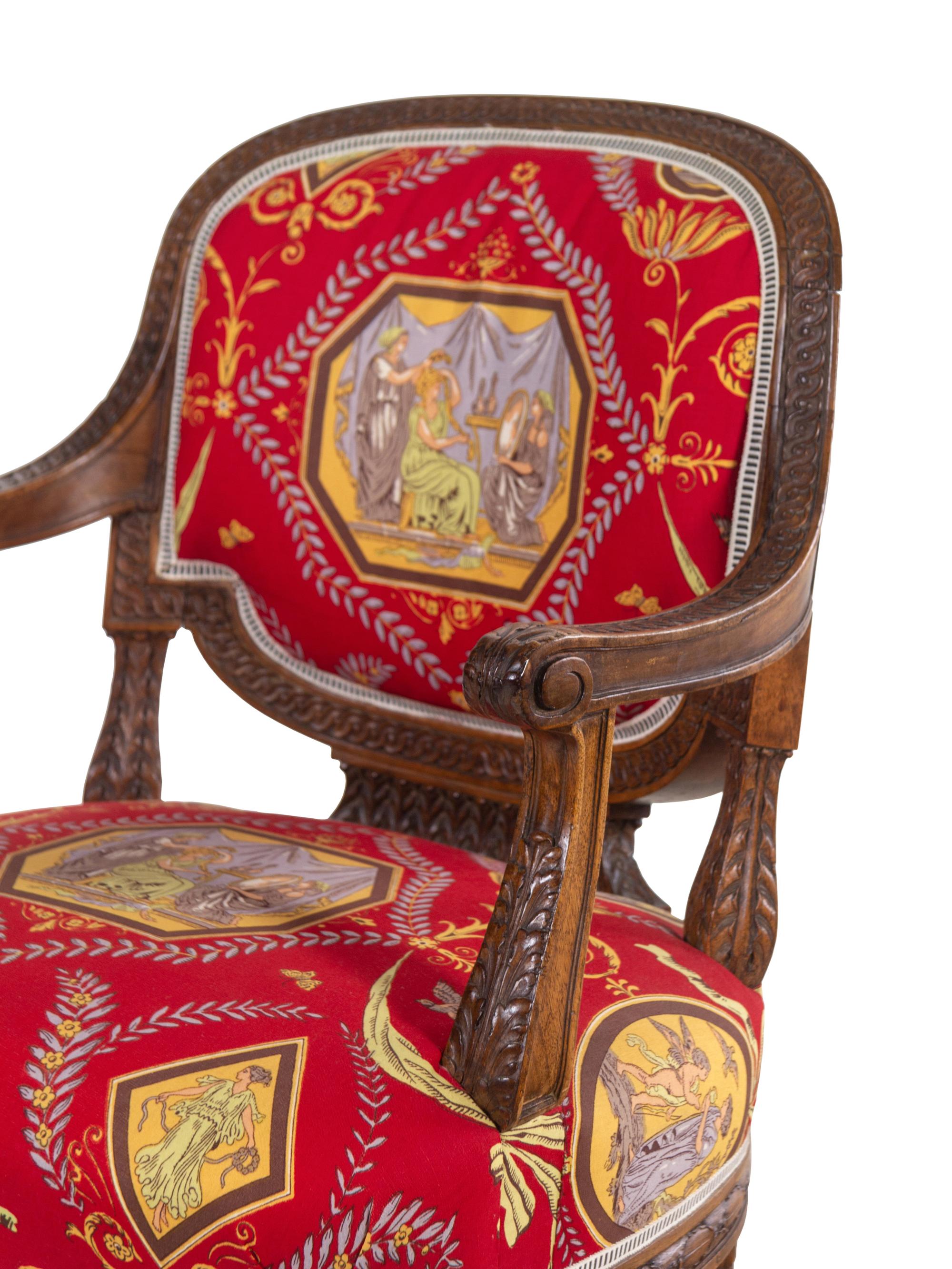 A Louis XVI Style Carved Armchair and Stool with Fortuny Upholstery