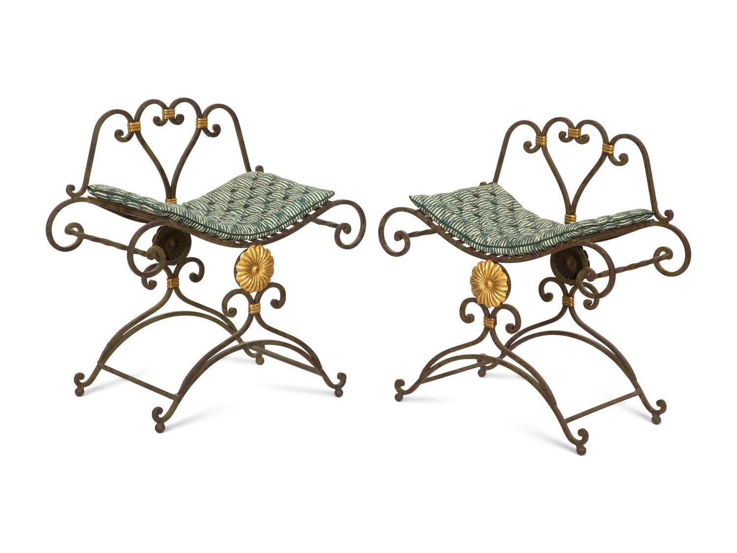 A Pair of Painted and Parcel Gilt Iron Curule Stools with Tufted Cushions