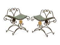 A Pair of Painted and Parcel Gilt Iron Curule Stools with Tufted Cushions