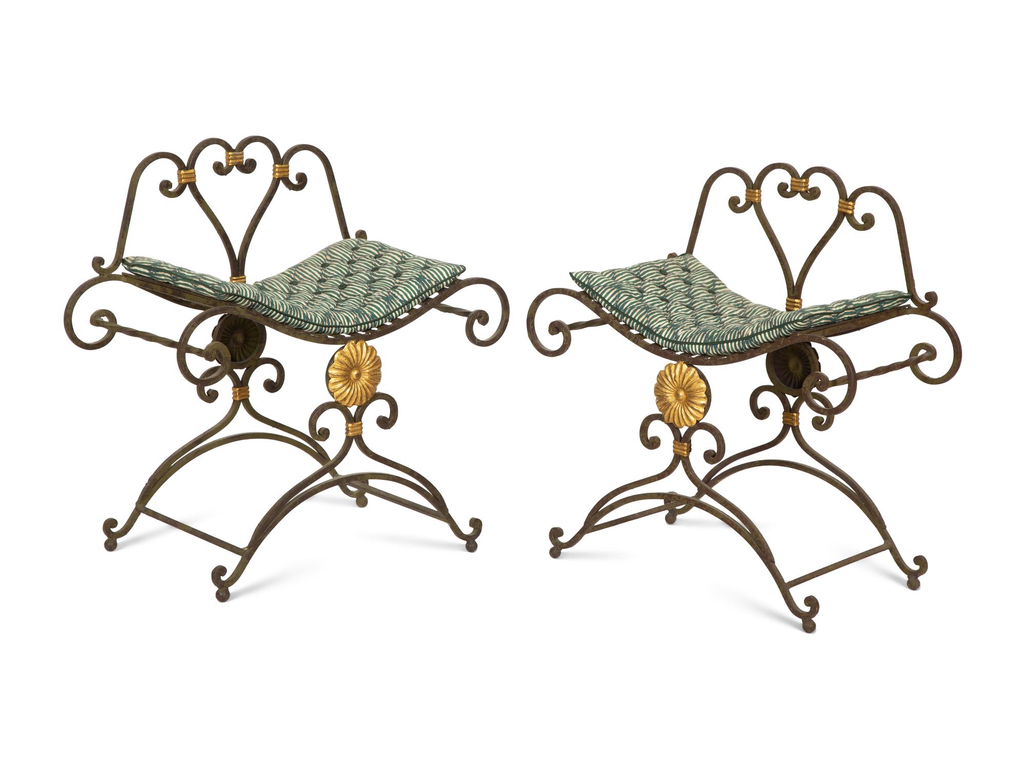 A Pair of Painted and Parcel Gilt Iron Curule Stools with Tufted Cushions