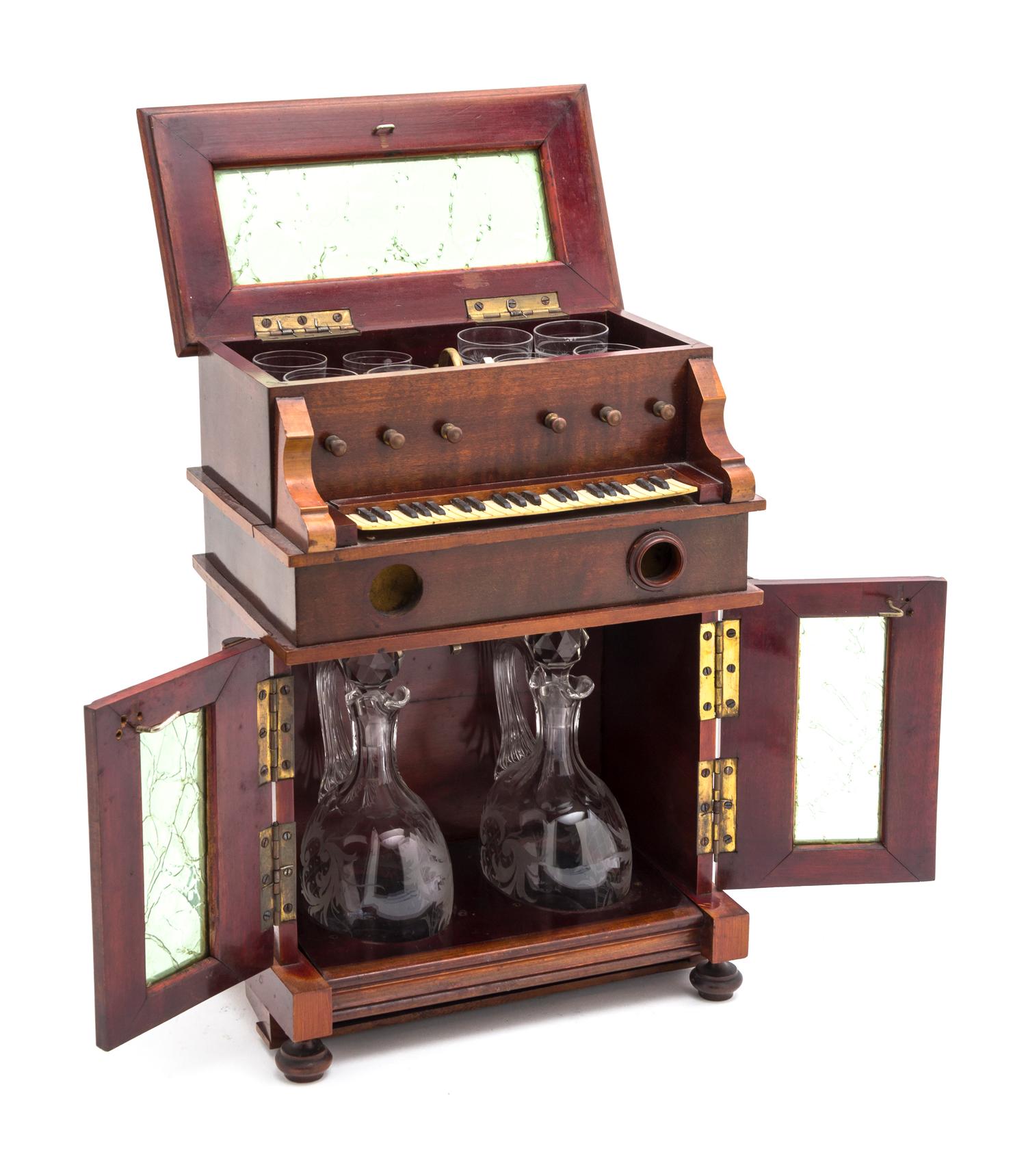 A Musical Cave a Liqueur Set, Height 12 inches.