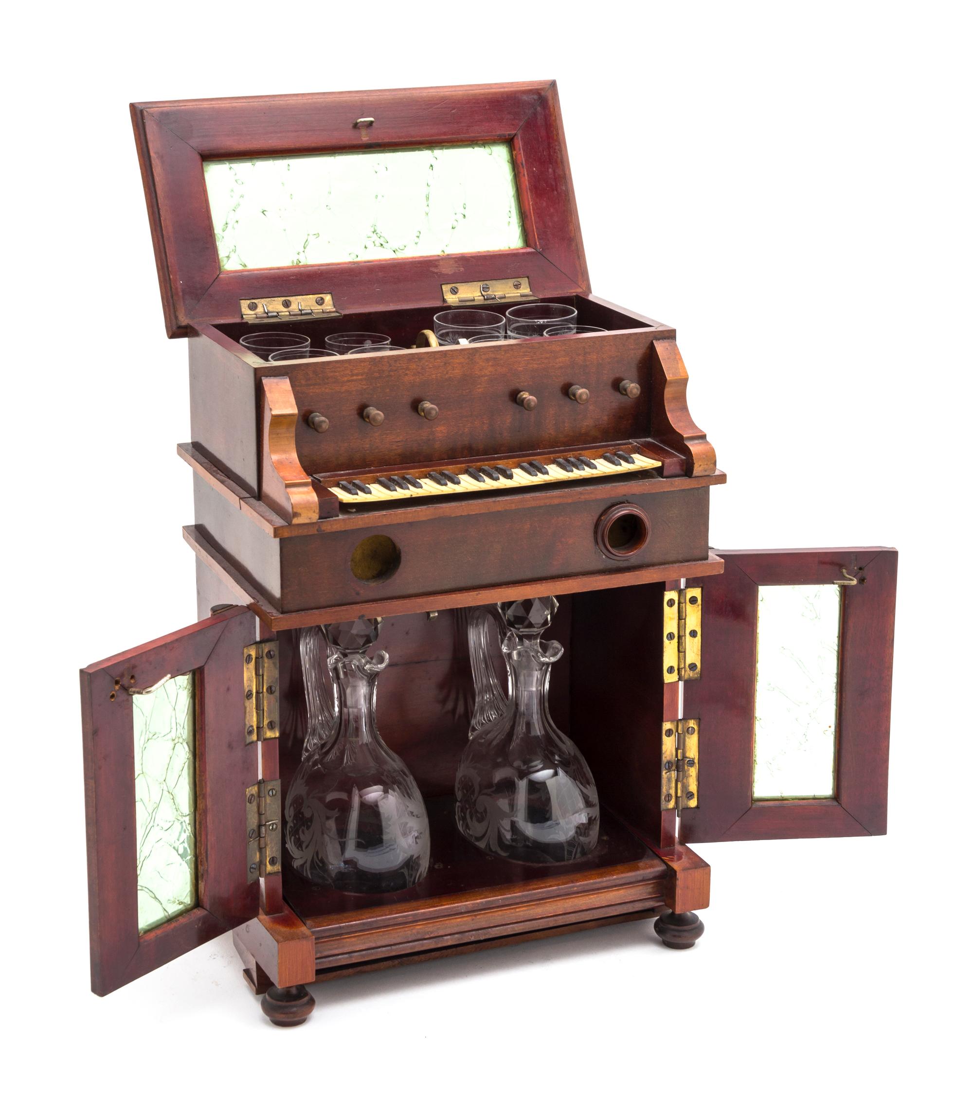 A Musical Cave a Liqueur Set, Height 12 inches.