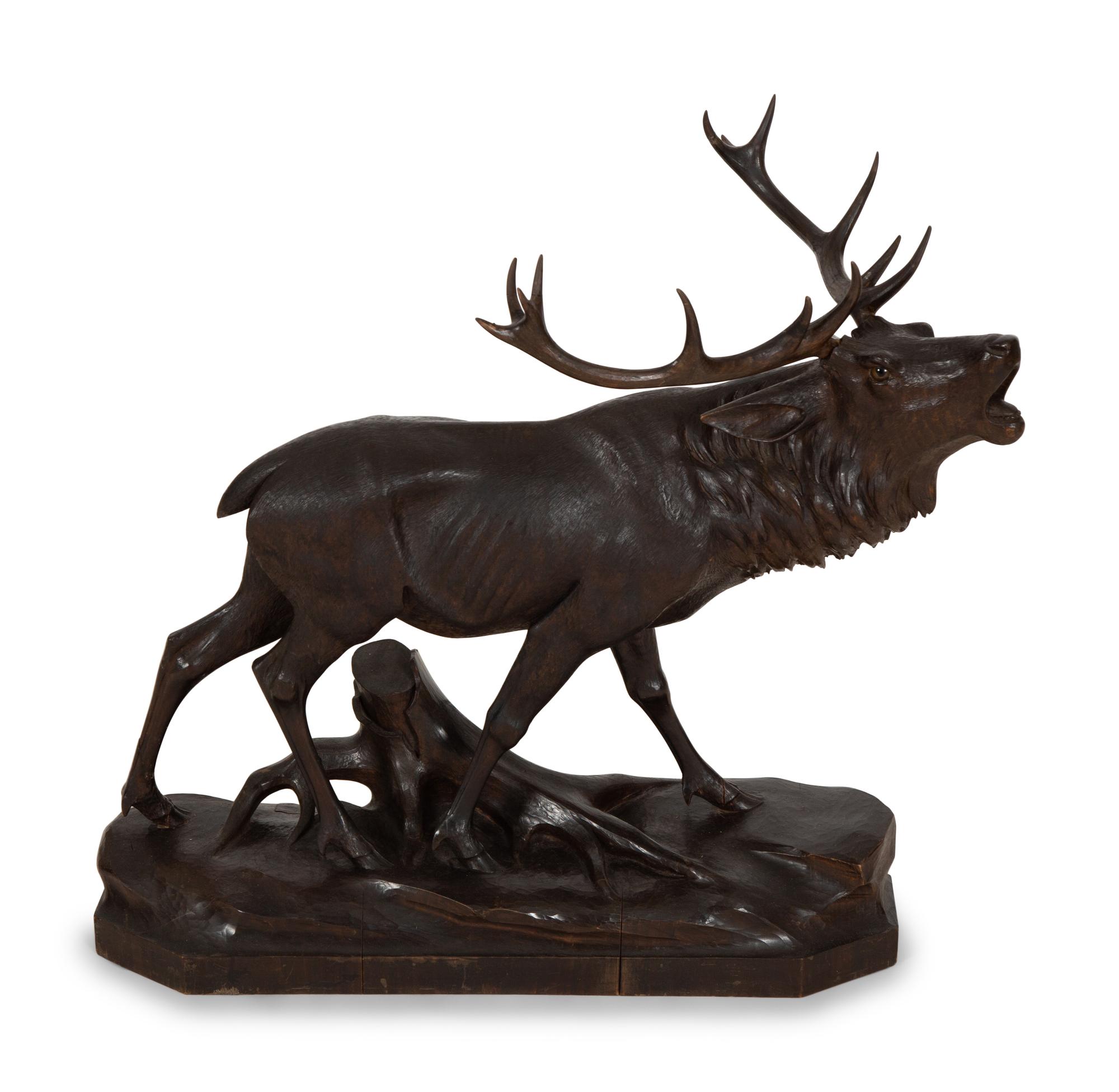A Swiss Black Forest Carved Walnut Figure of an Elk