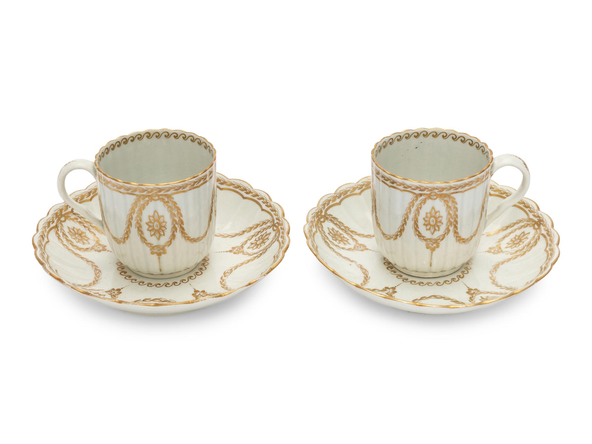 A Pair of Worcester Porcelain Cups and Saucers