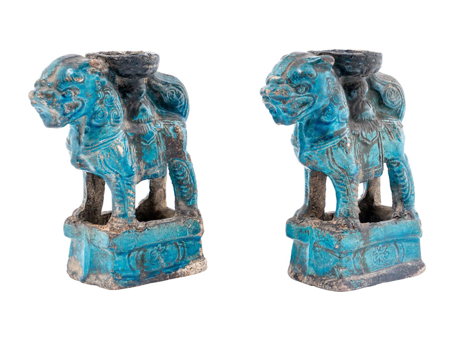 A Pair of Chinese Turquoise Glazed Pottery Fu Lion-Form Candle Holders