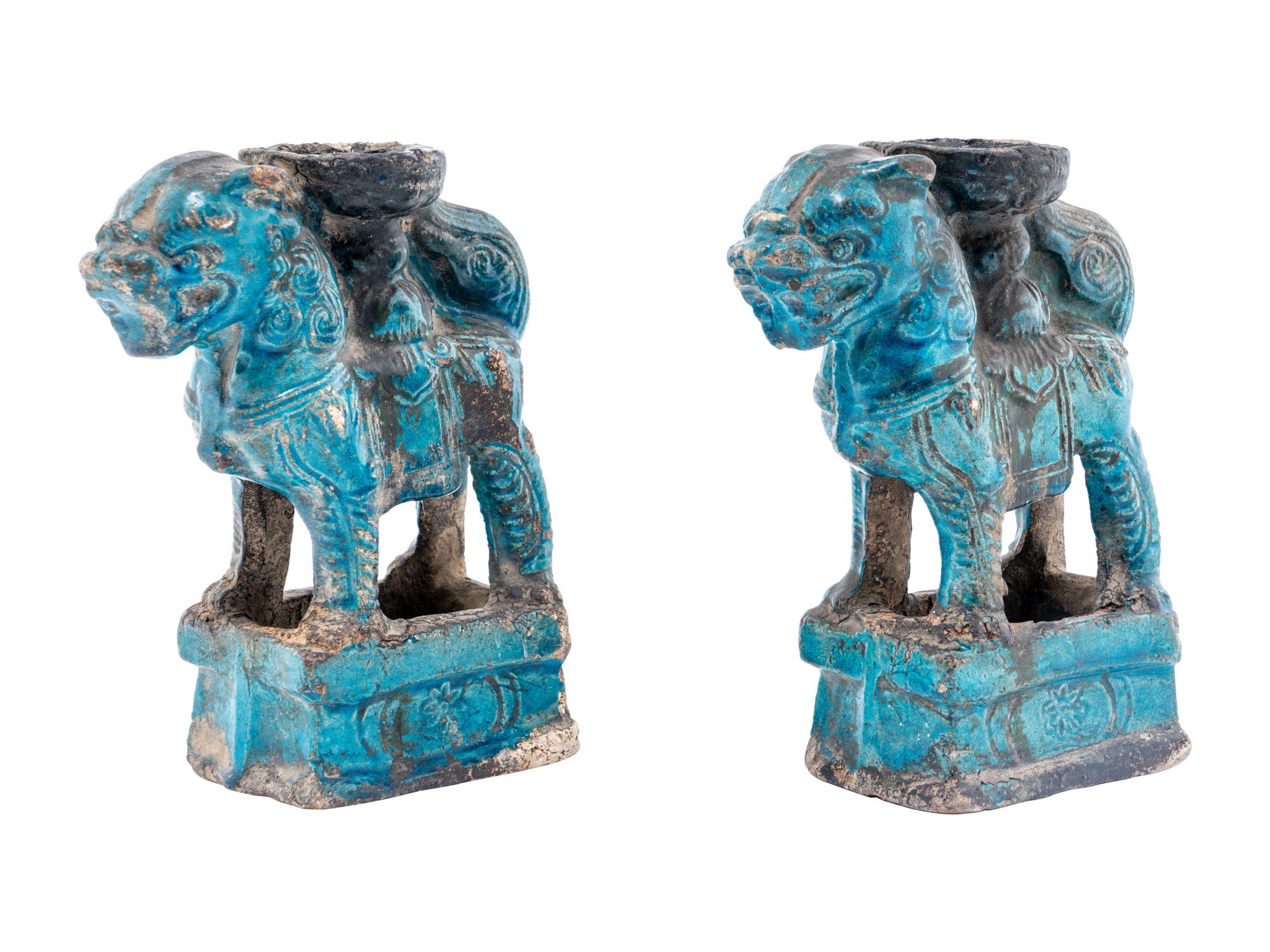 A Pair of Chinese Turquoise Glazed Pottery Fu Lion-Form Candle Holders