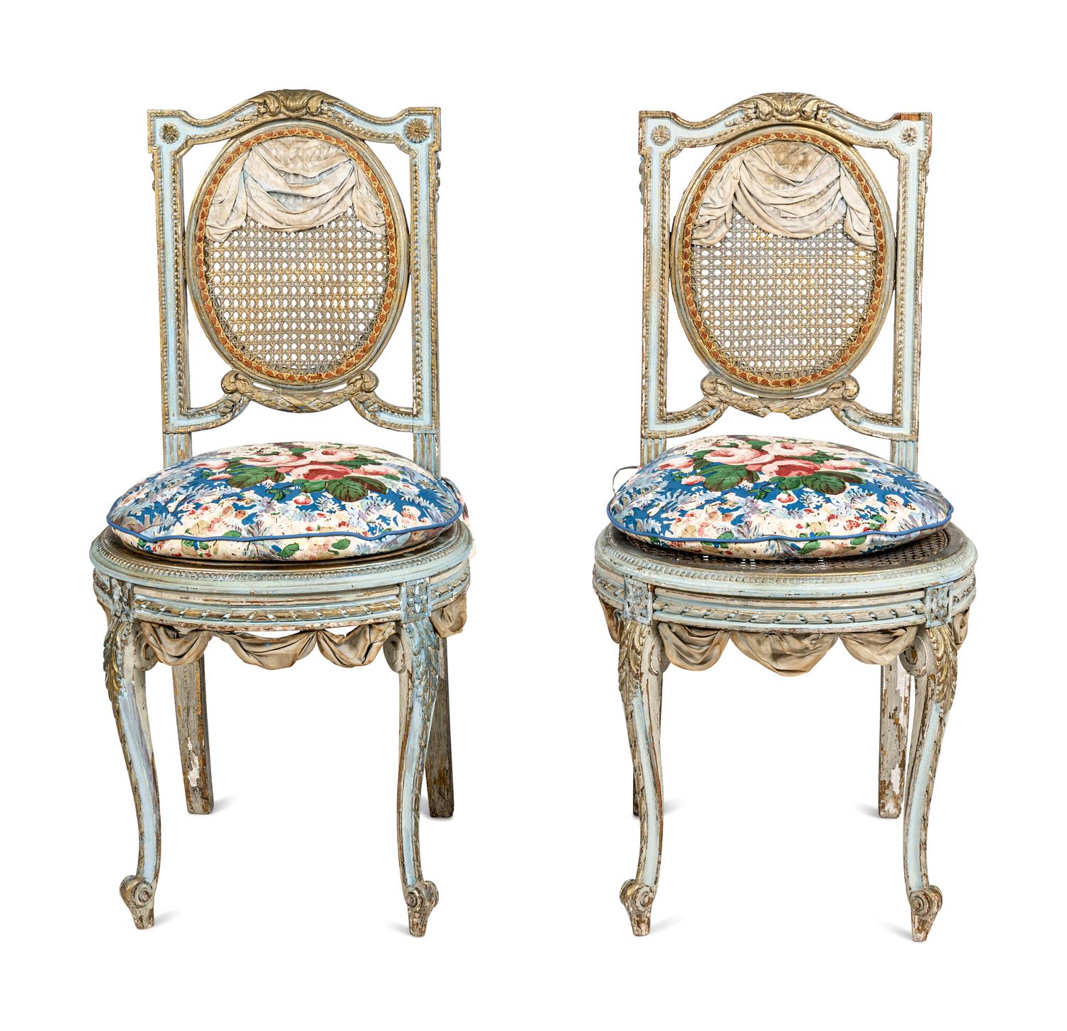 A Pair of Louis XVI Style Painted and Parcel-Gilt Chaises