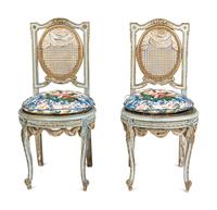 A Pair of Louis XVI Style Painted and Parcel-Gilt Chaises