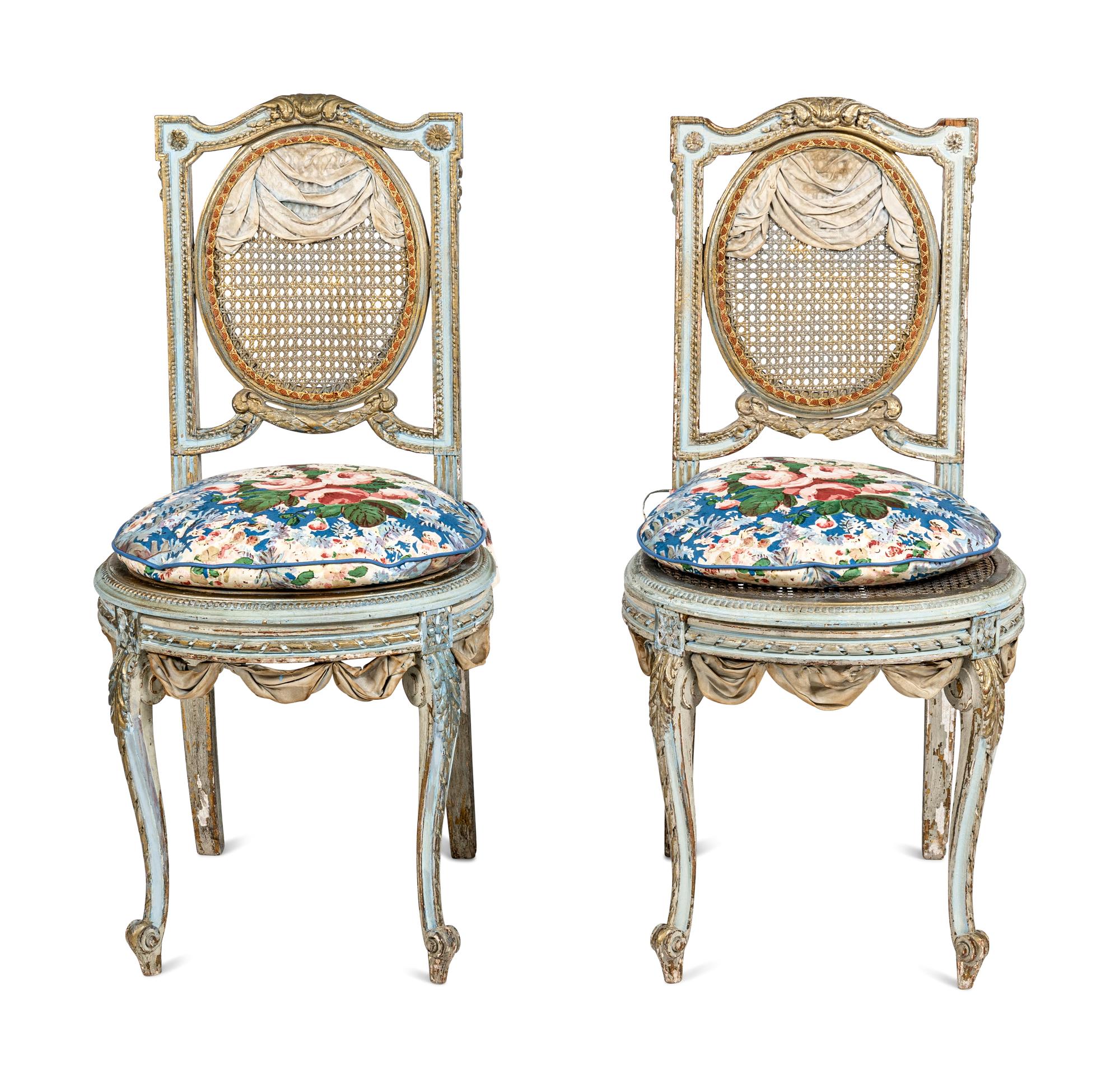 A Pair of Louis XVI Style Painted and Parcel-Gilt Chaises