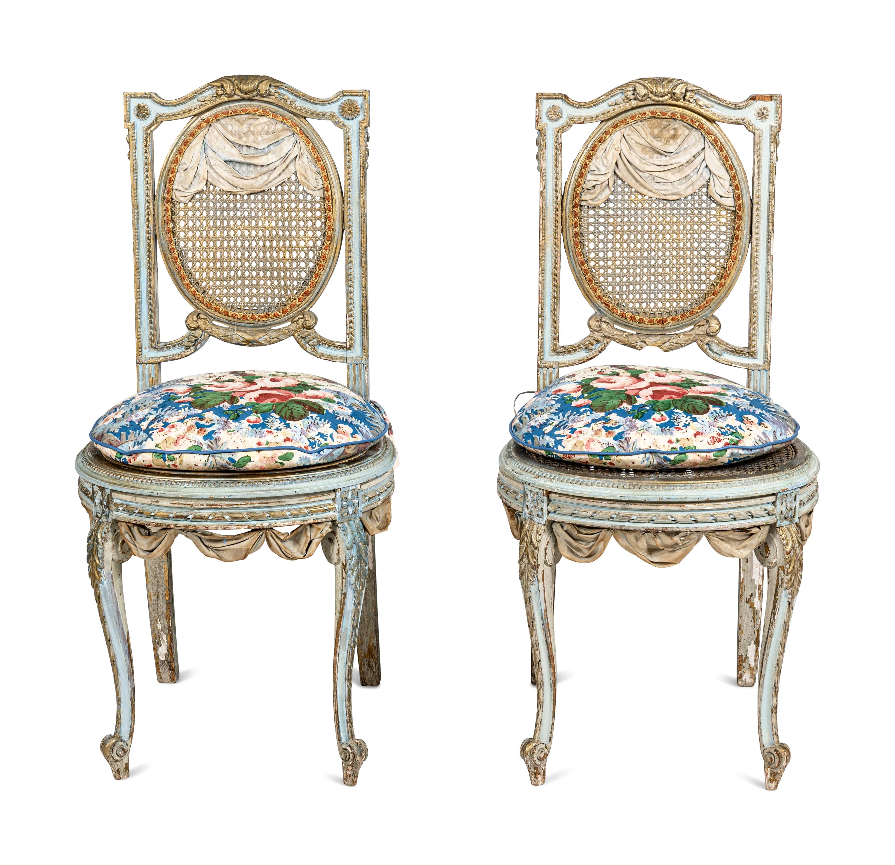 A Pair of Louis XVI Style Painted and Parcel-Gilt Chaises