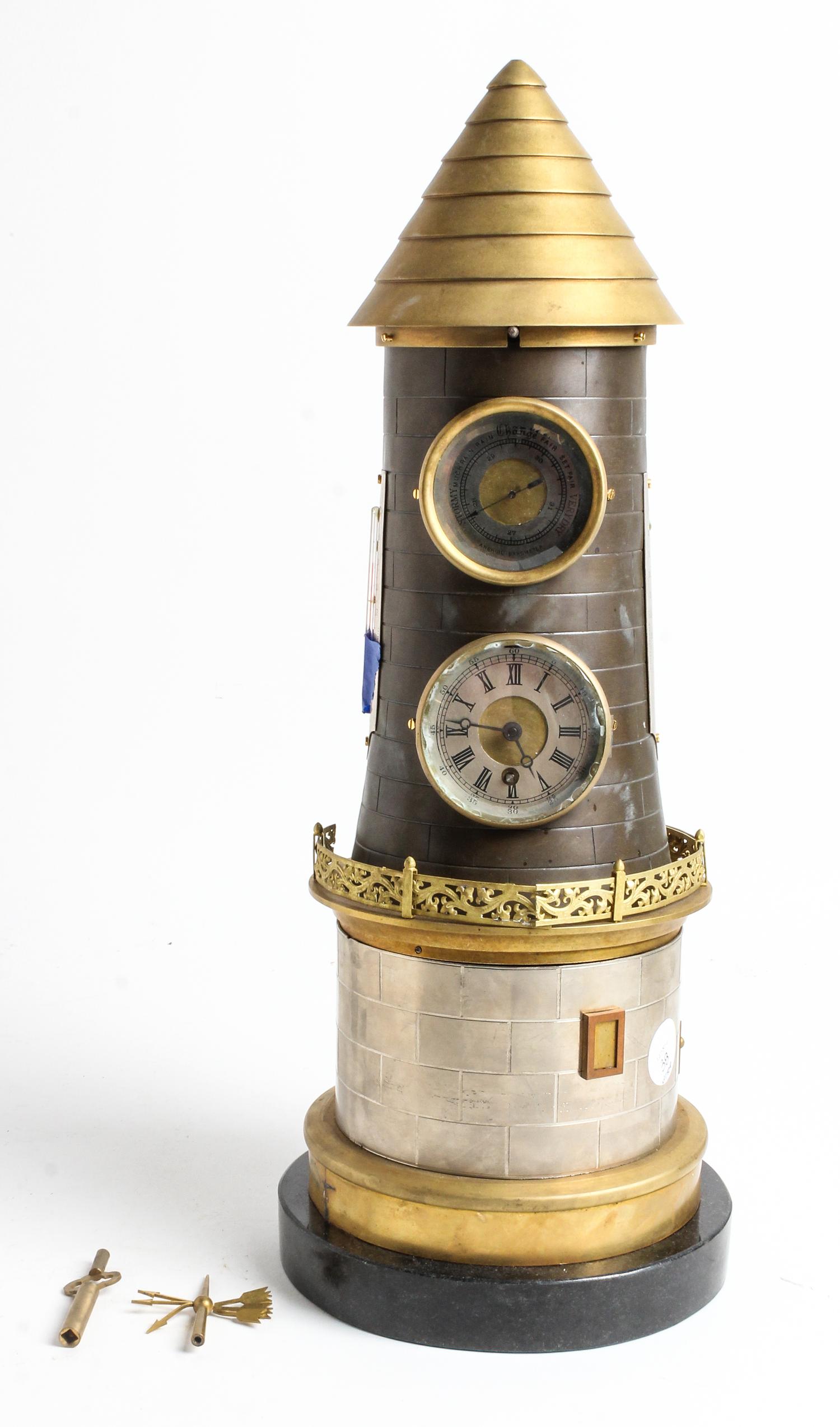 A Cast Metal Lighthouse Clock Height 19 inches. — EARLY 20TH CENTURY
