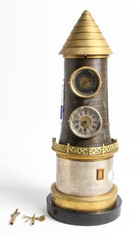 A Cast Metal Lighthouse Clock Height 19 inches. — EARLY 20TH CENTURY
