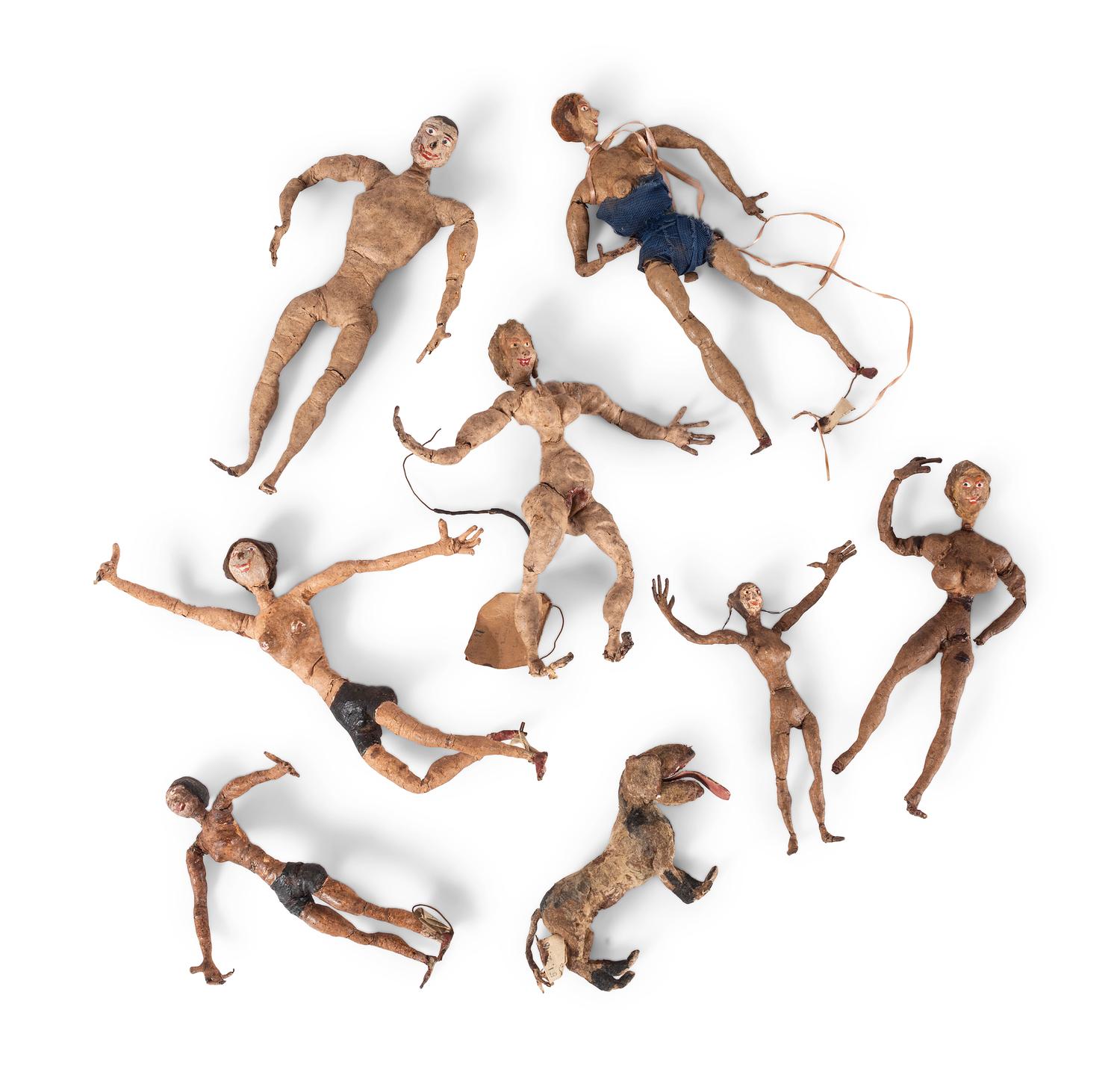 Eighteen Painted Rubber Folk Art Figurines