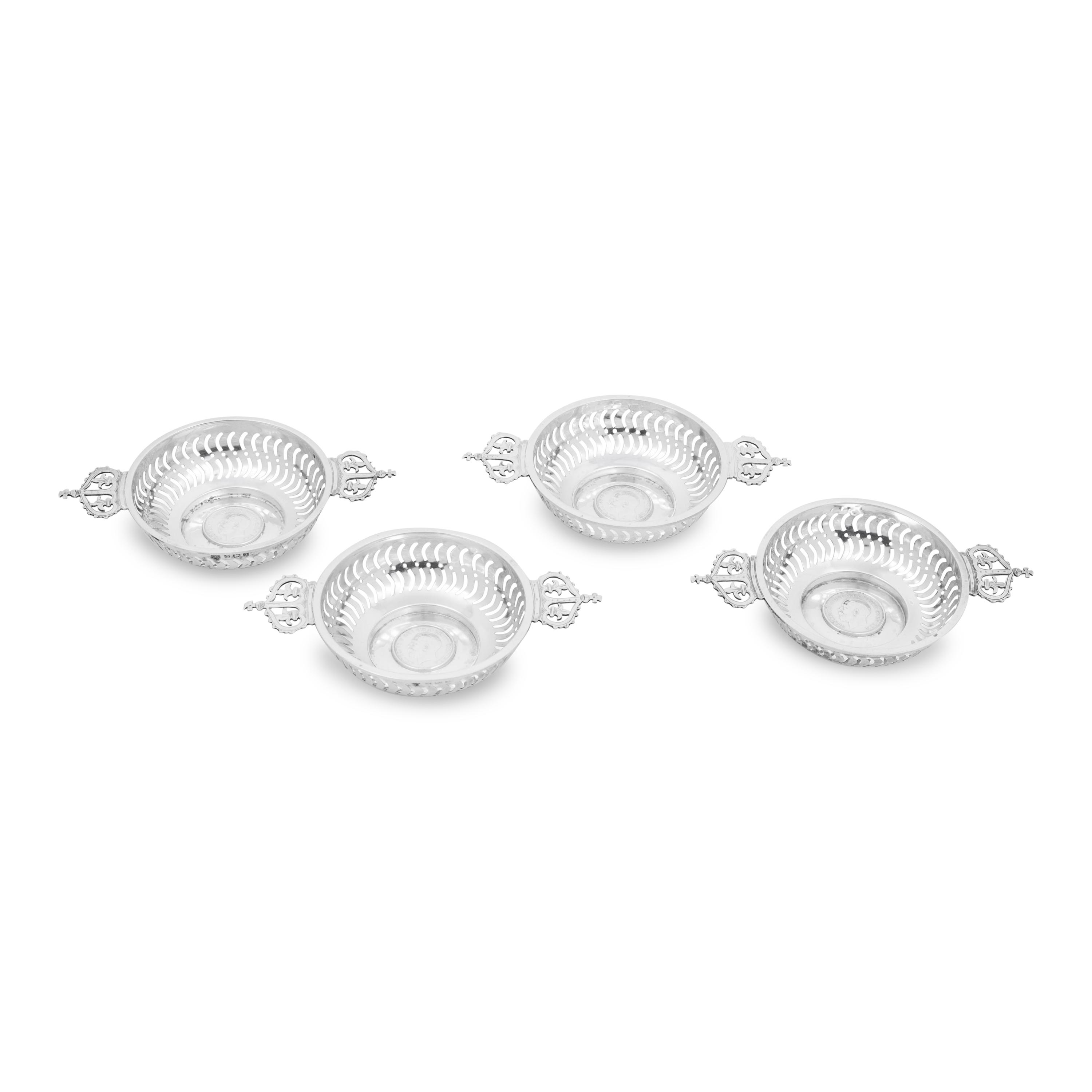 A Set of Four English Silver Coin-Inset Nut Dishes