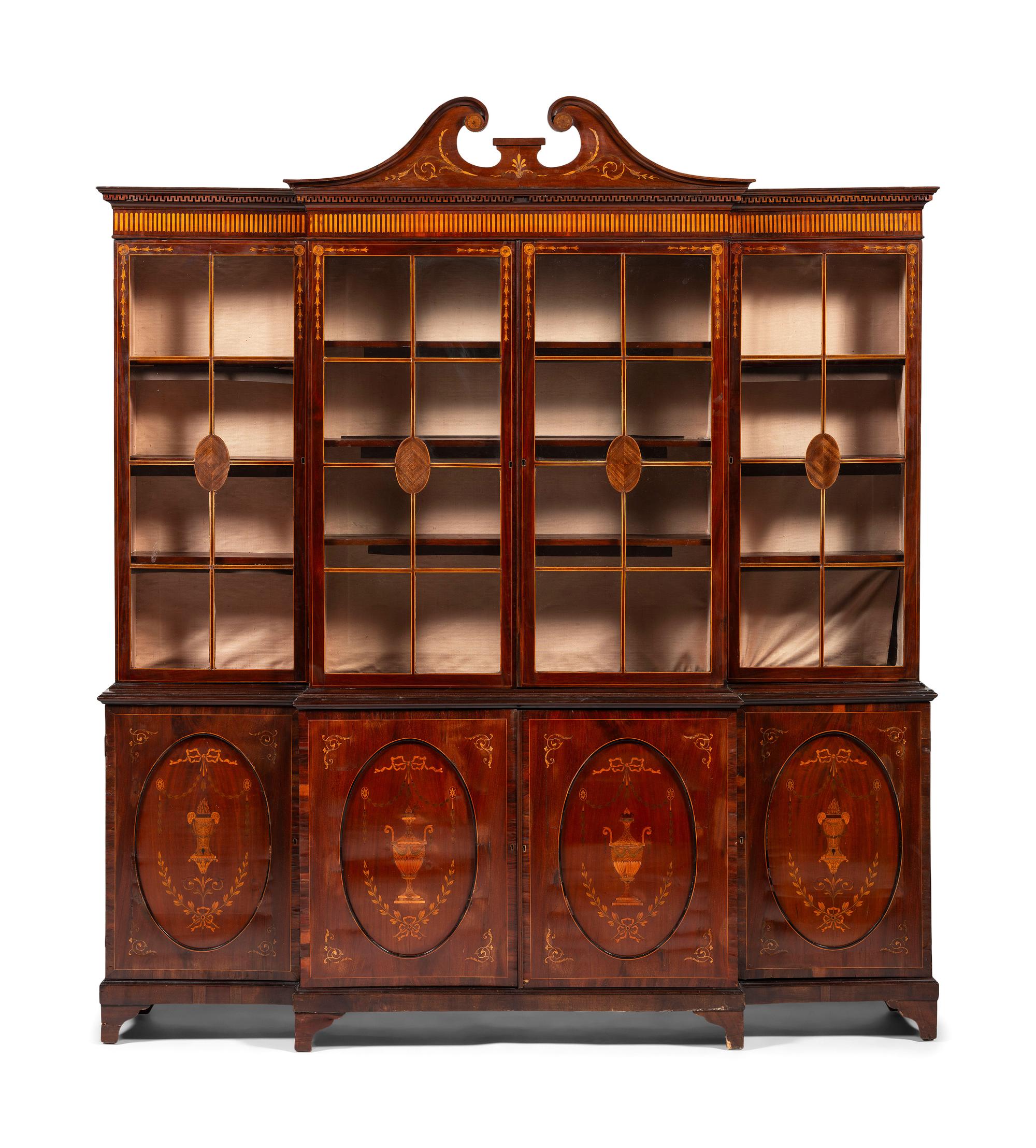 An English Mahogany and Marquetry Breakfront Bookcase