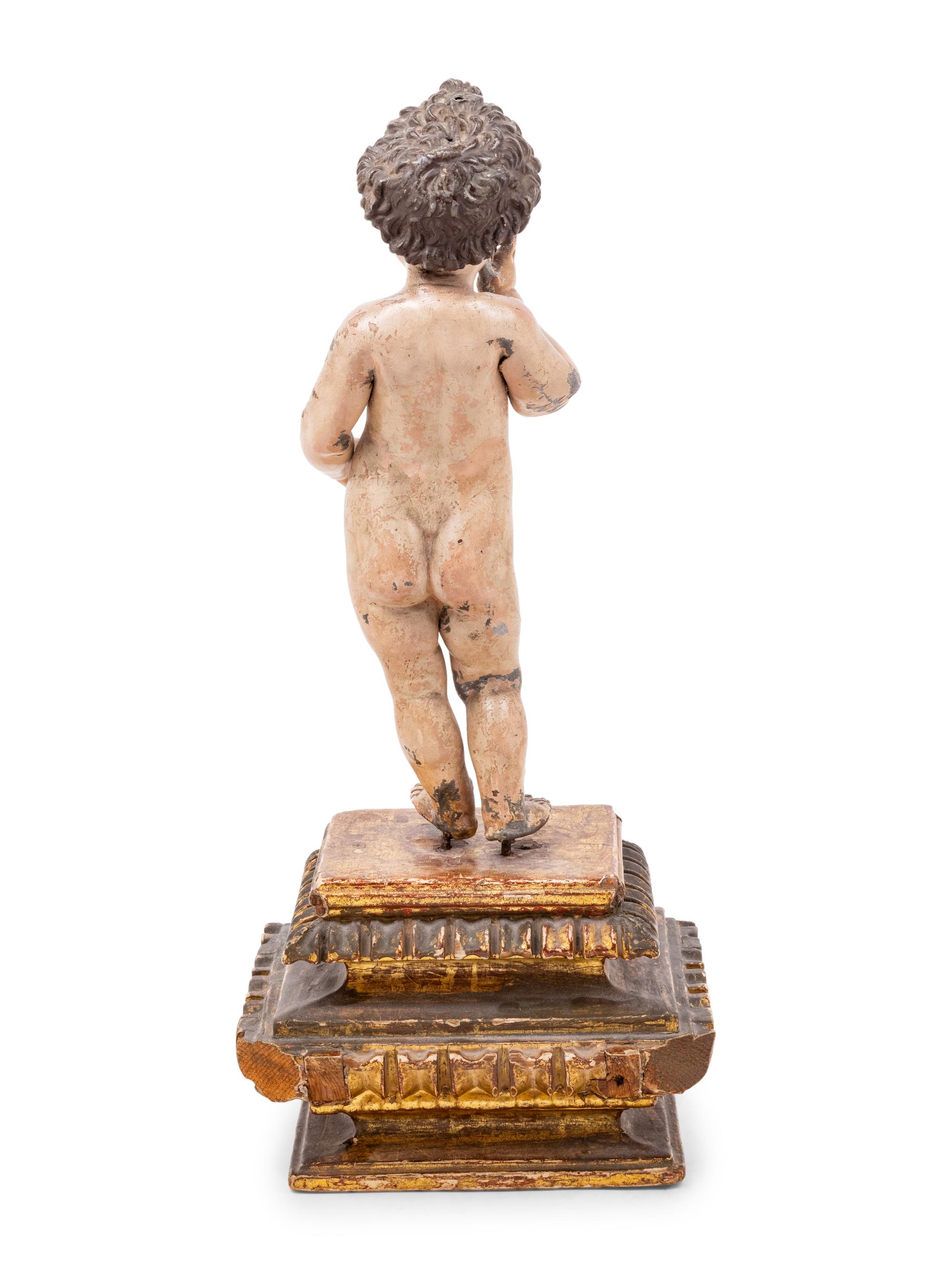 An Italian Painted Putto Figure