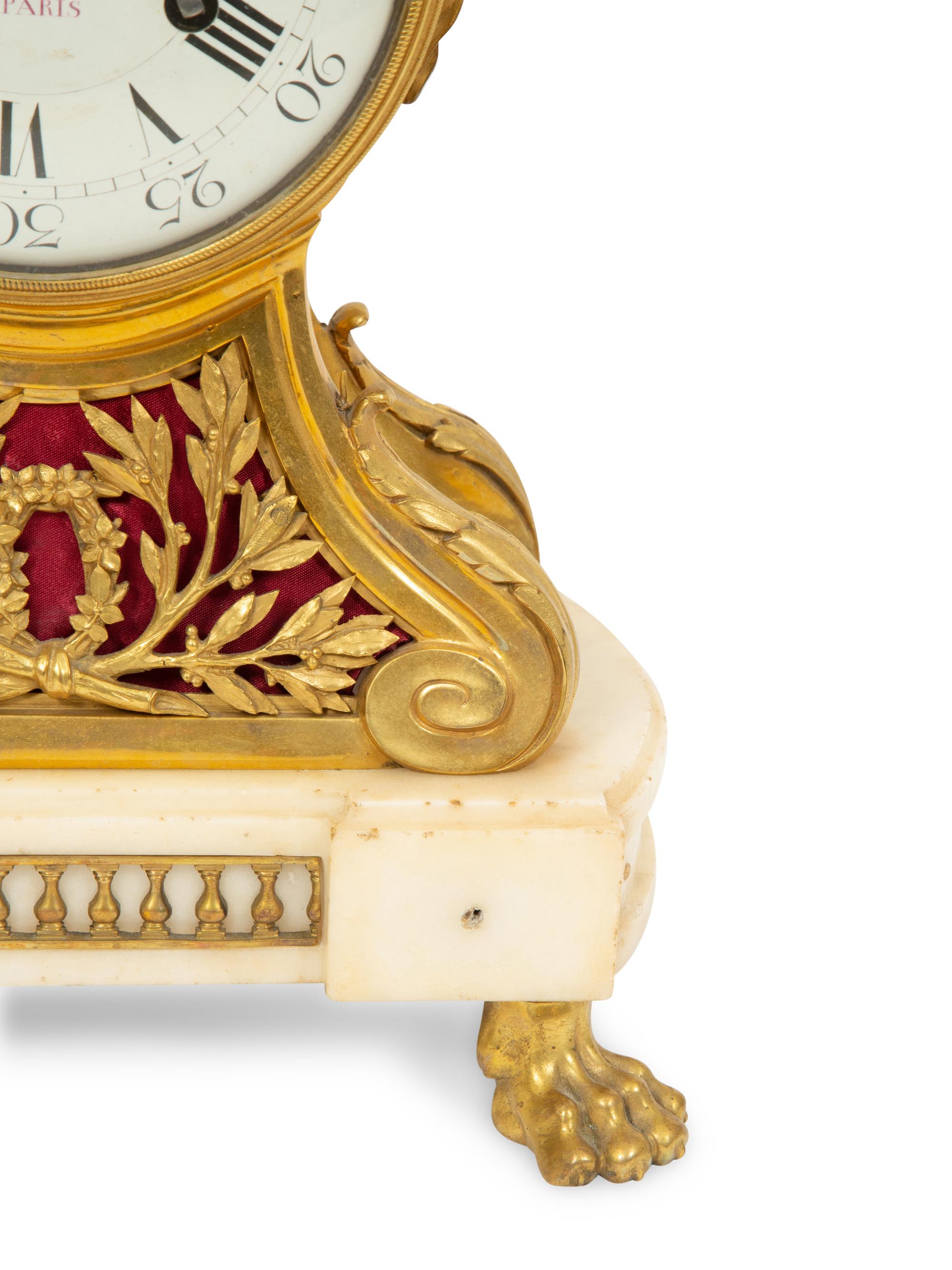 A Louis XVI Gilt Bronze and Marble Mantel Clock
