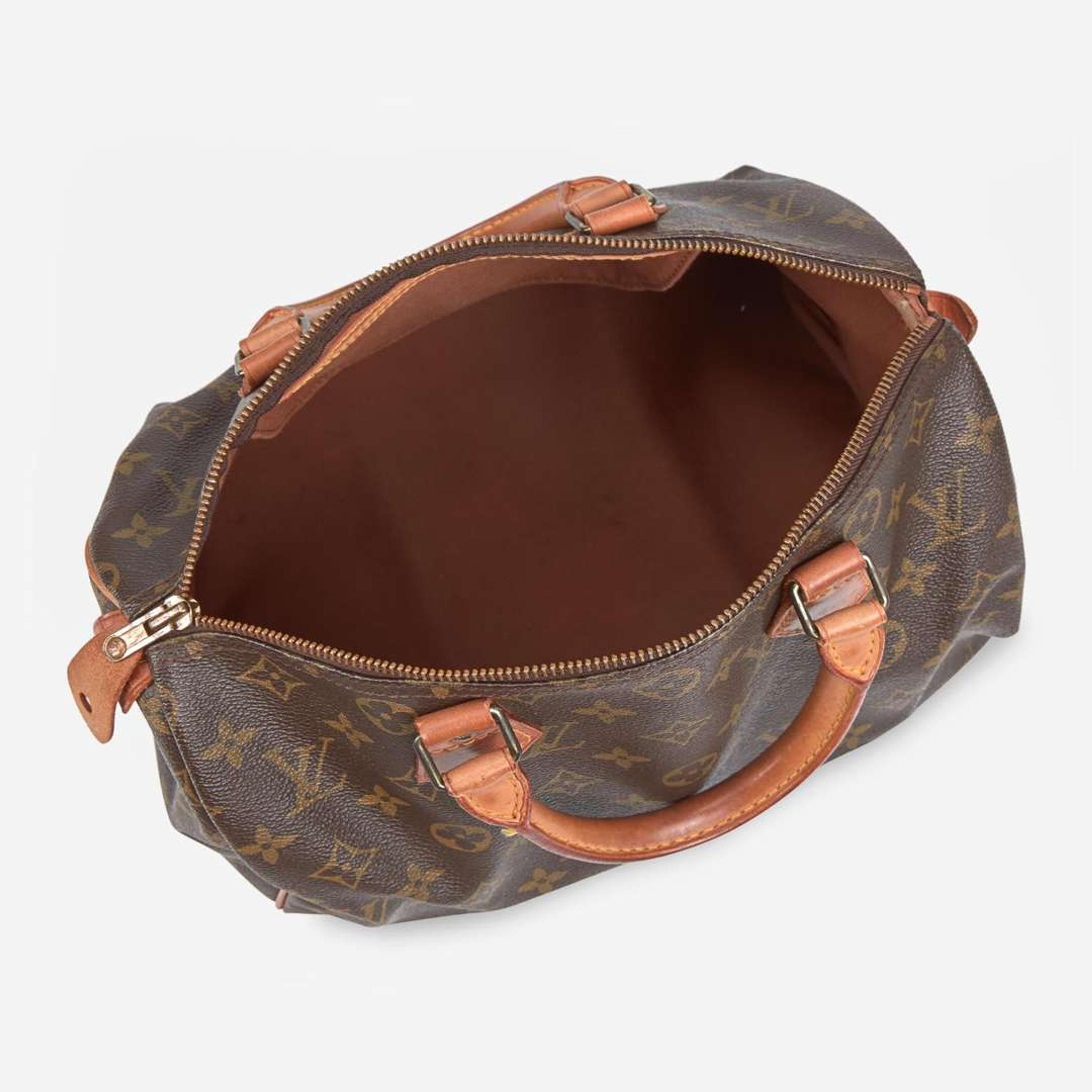 A Louis Vuitton Brown Monogram Speedy 30 Louis Vuitton