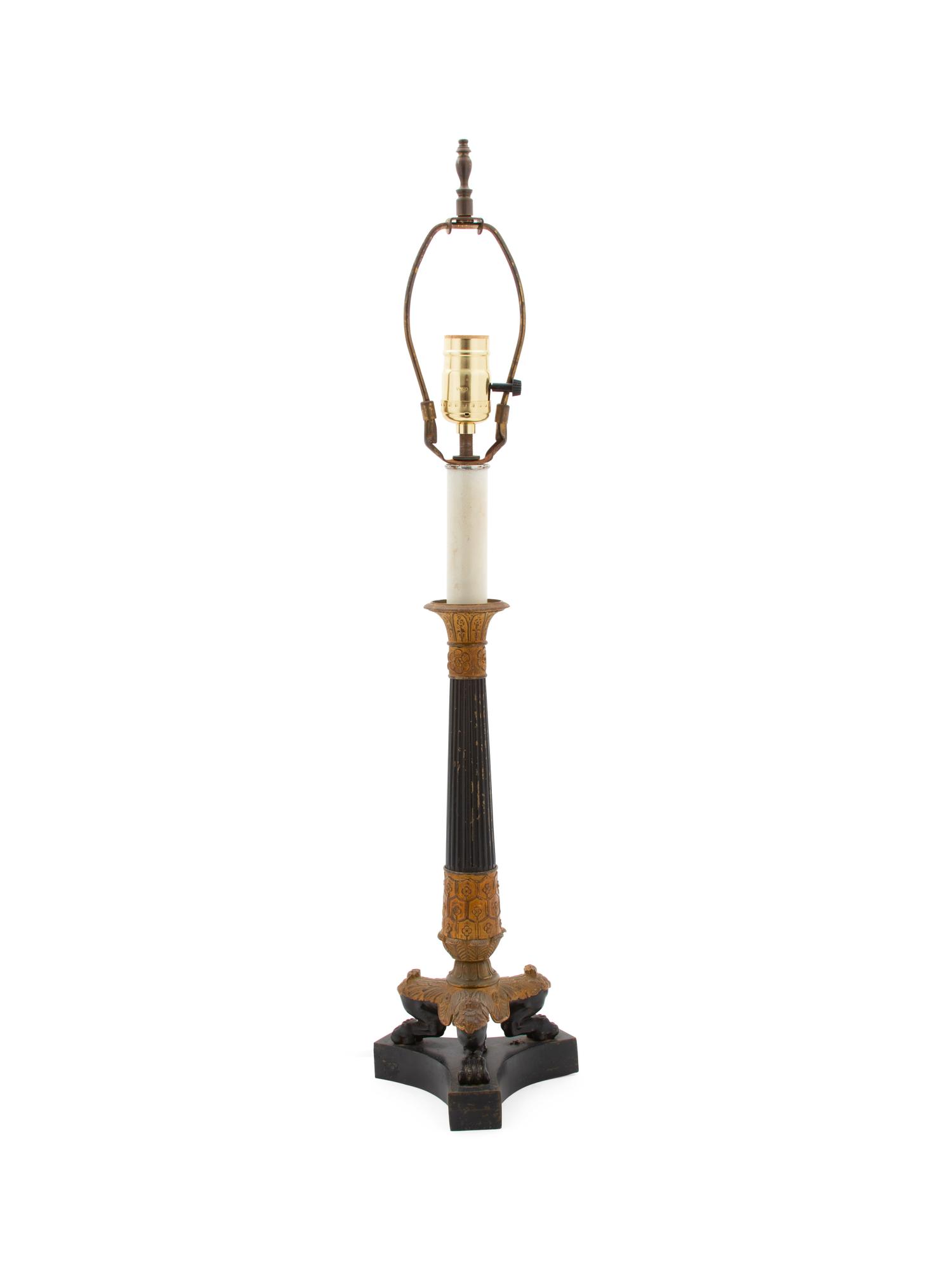 An Empire Style Ebonized and Gilt Metal Table Lamp