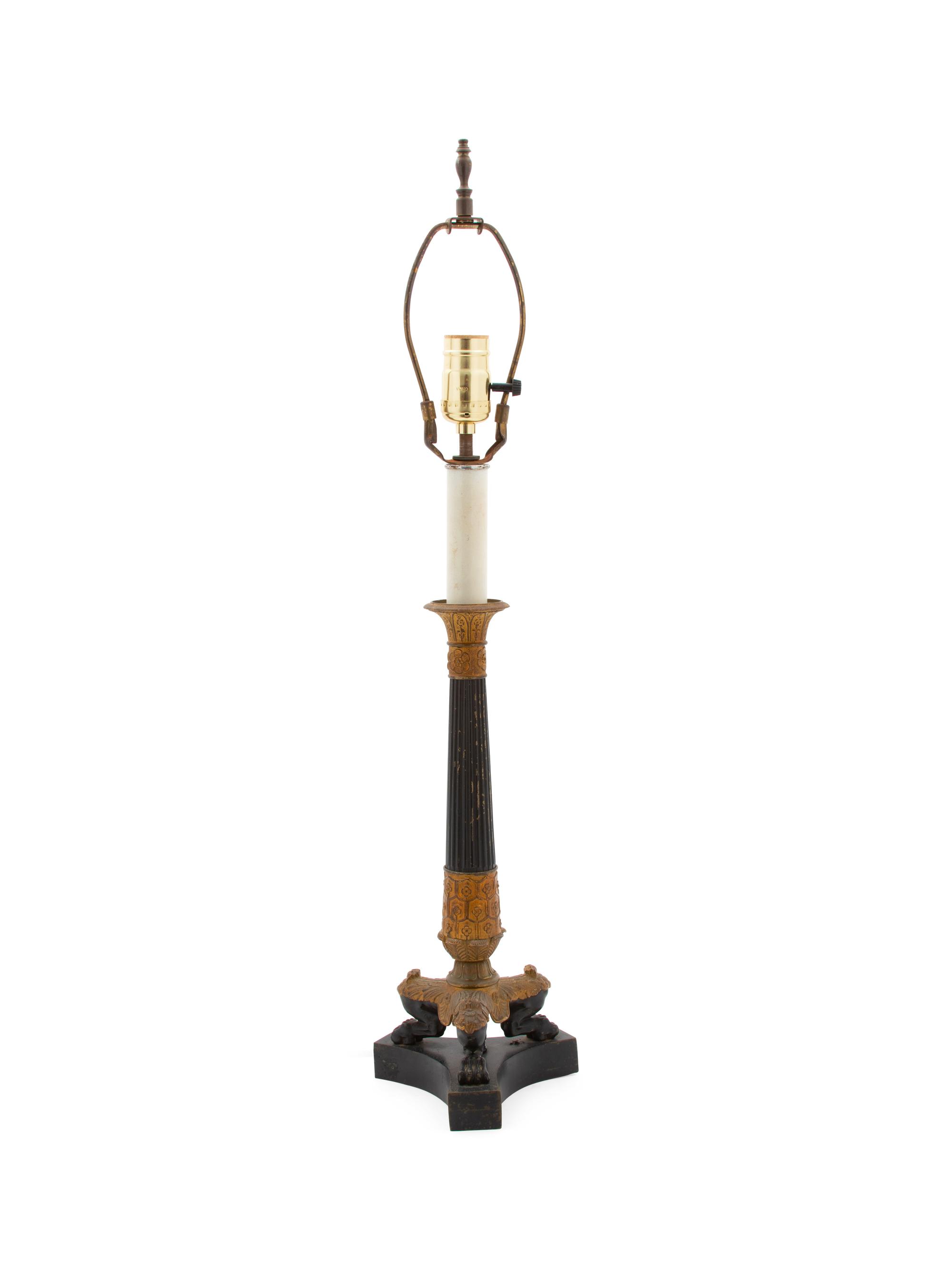 An Empire Style Ebonized and Gilt Metal Table Lamp