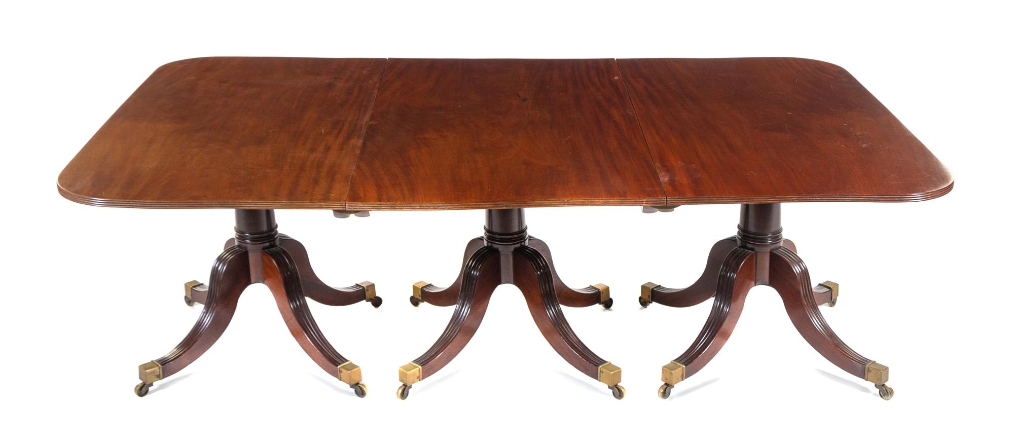 A George III Style Mahogany Triple-Pedestal Dining Table Height 28 x length 112 3/4 x depth 52 1/4 inches. — 19TH CENTURY