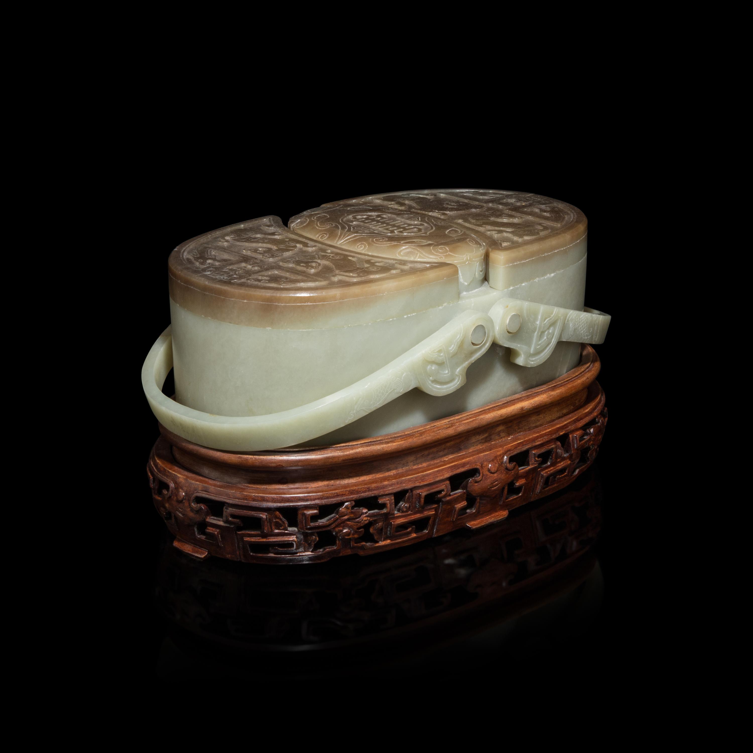 A Chinese Pale Celadon and Russet Jade Box and Cover, 20th Century 近代 青玉提梁式蓋盒