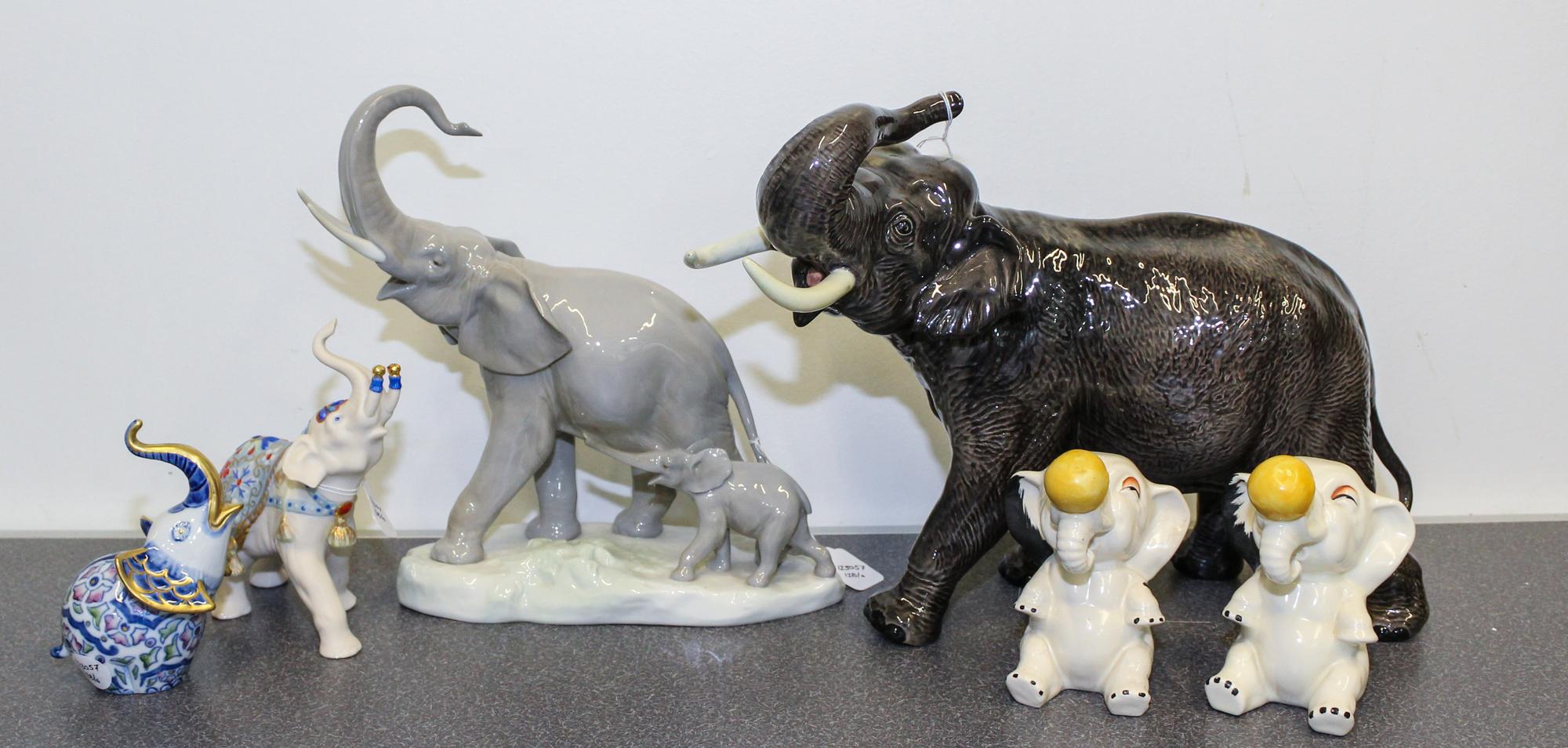 A Collection of Six Porcelain Elephant Figures Height of tallest 10 1/2 inches.