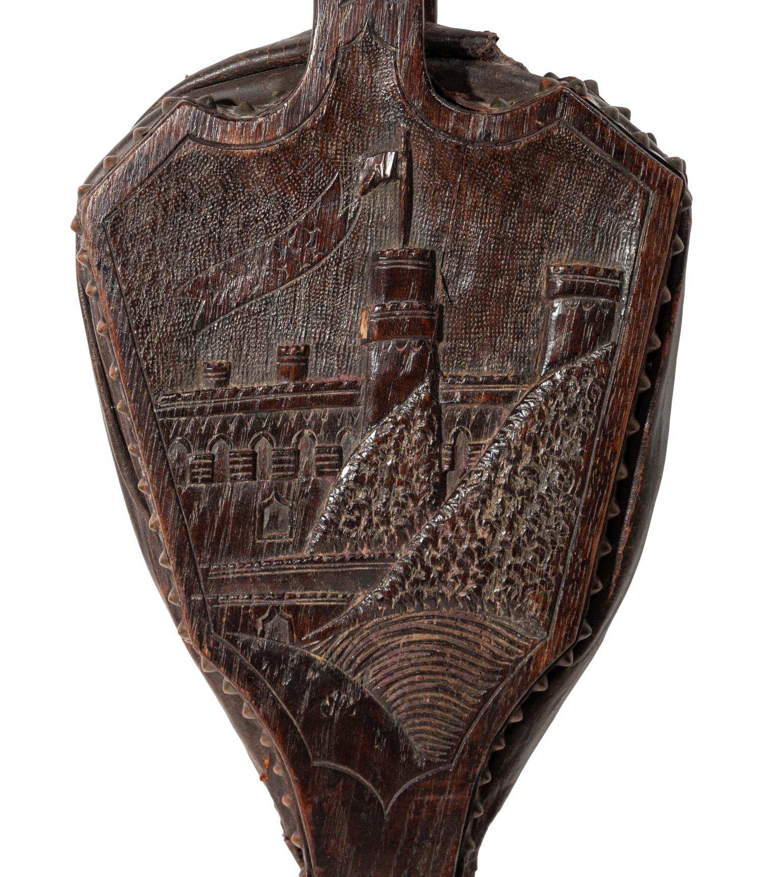 An English Carved Oak Bellows Depicting Warwick Castle