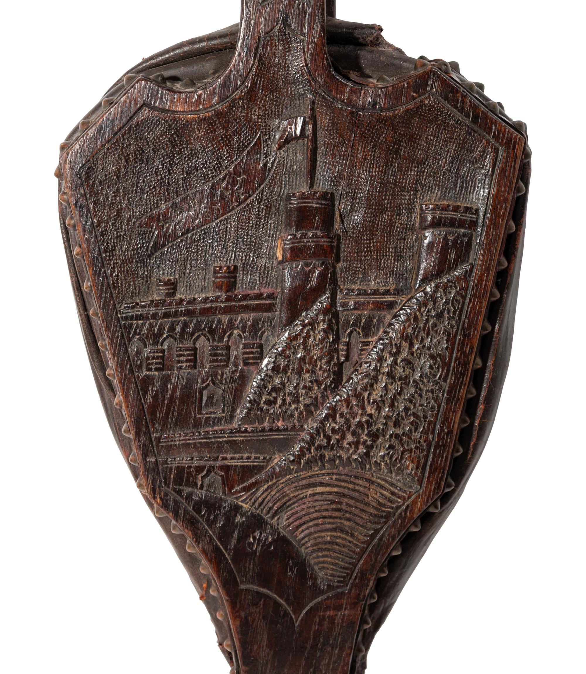 An English Carved Oak Bellows Depicting Warwick Castle