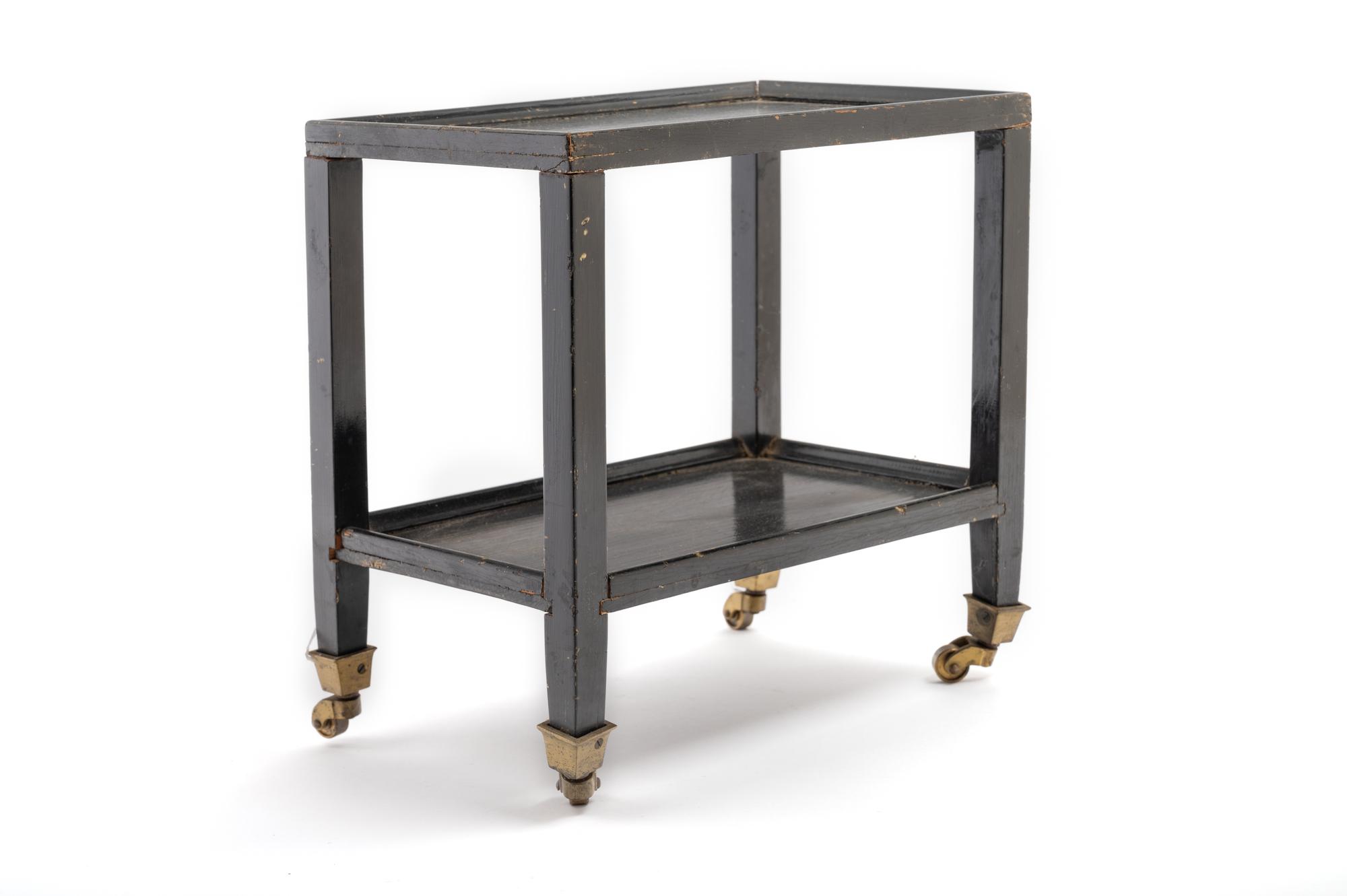 A Black Painted "Telephone Table" in the Style of Karl Springer